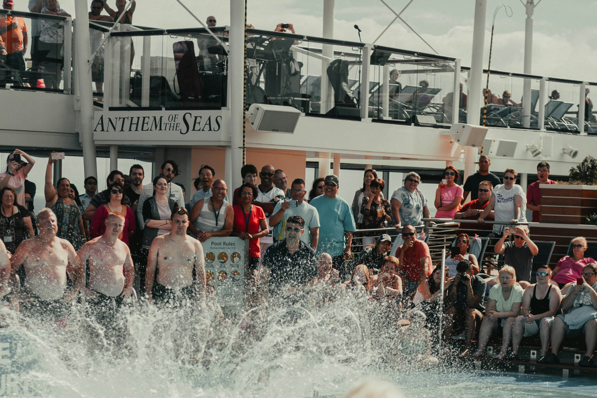 Travelers enjoying a poolside activity aboard a cruise ship, showcasing onboard leisure experiences that define 2025 Cruise Trends.