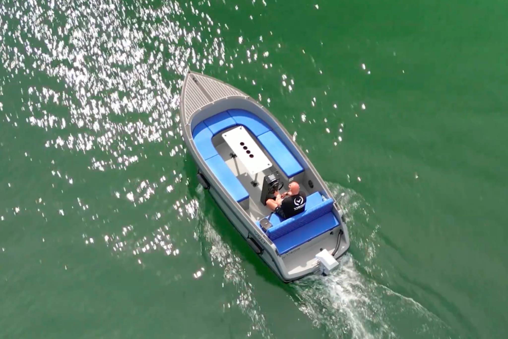 An overhead view of the 2025 Volt 180 in use on calm green waters, showing how the boat suits casual cruising, eco-conscious users, and relaxed day outings.