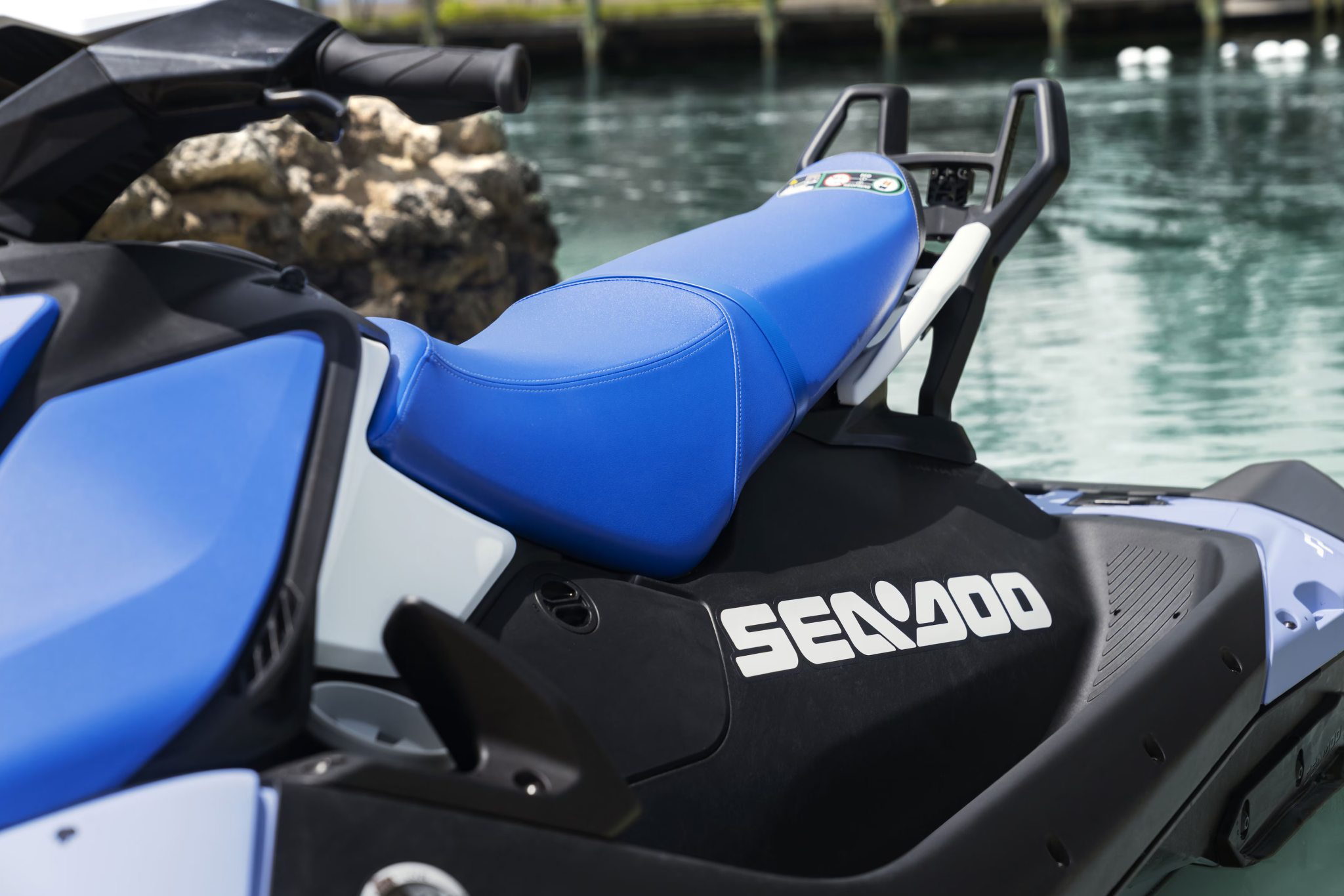 Close-up of the seat and rear grab handles on the 2026 Sea-Doo Spark, showing the compact layout and passenger-friendly design.