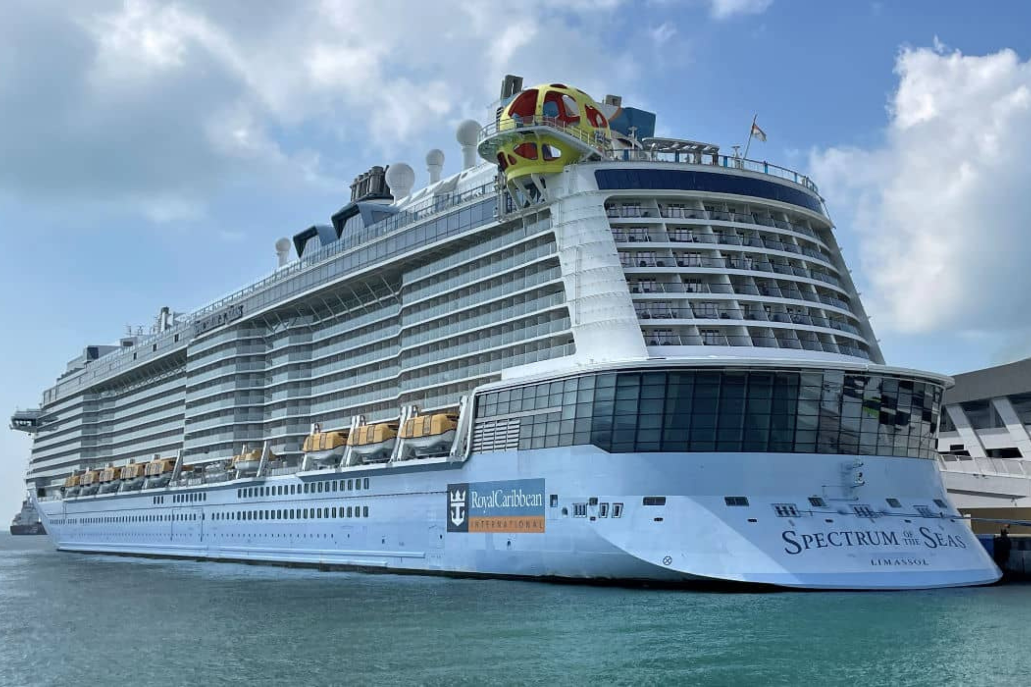Royal Caribbean Ships by Size comparison featuring Spectrum of the Seas, a Quantum Ultra Class ship, highlighting its streamlined design and upper-deck attractions