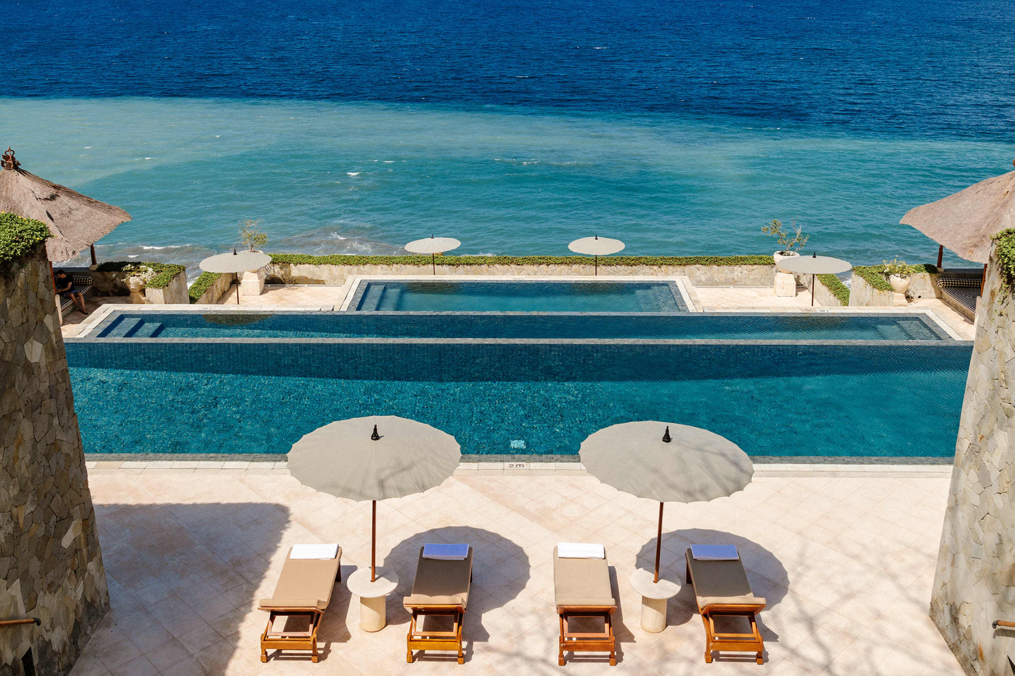 Signature three-tiered infinity pool at Amankila with panoramic views of the Bali Sea