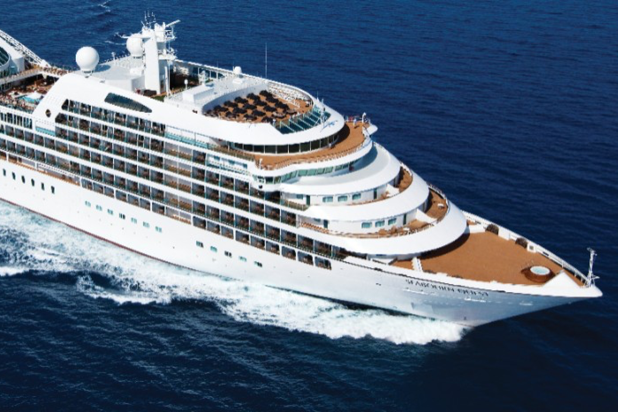 Seabourn cruise ship sailing at sunset, ranked 2nd in the best adults-only cruises for expedition experiences and indulgent comfort.