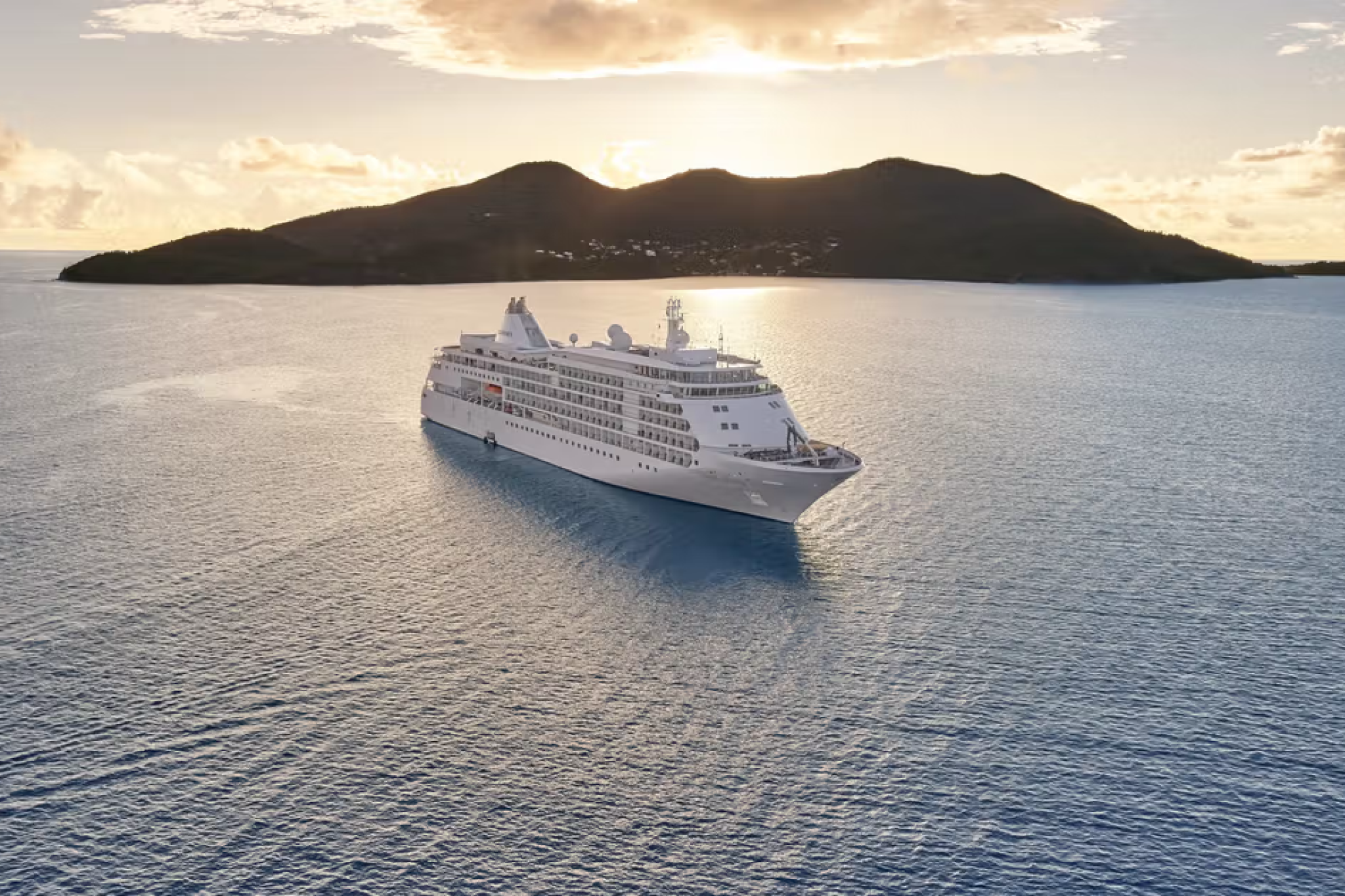Silversea Cruises luxury vessel near tropical islands, ranked 3rd among the best adults-only cruises for ultra-luxury worldwide travel.