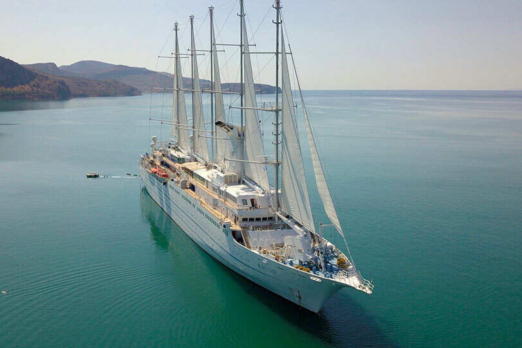 Windstar Cruises luxury sailing ship at sea, ranked 7th among the best adults-only cruises for its boutique, yacht-like experience.