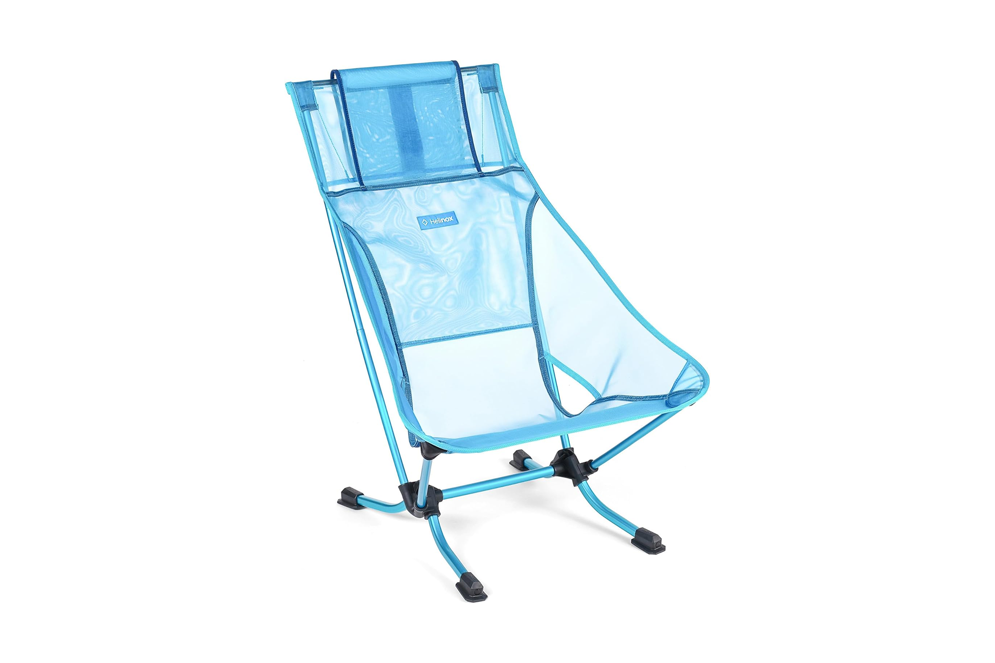 Lightweight Helinox Beach Chair in translucent blue mesh with compact, foldable aluminum frame — a top choice among the best beach chairs for travel and ease.