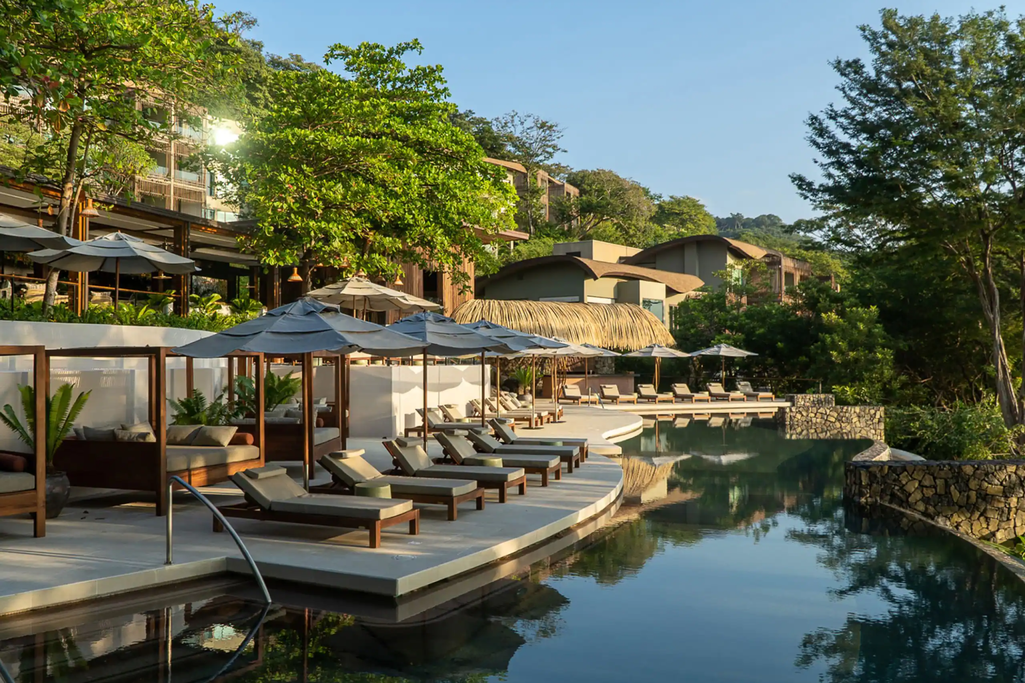 Infinity-edge pool surrounded by forest at Andaz Peninsula Papagayo—one of the best beach hotels in Costa Rica for upscale resort comfort and Pacific views.