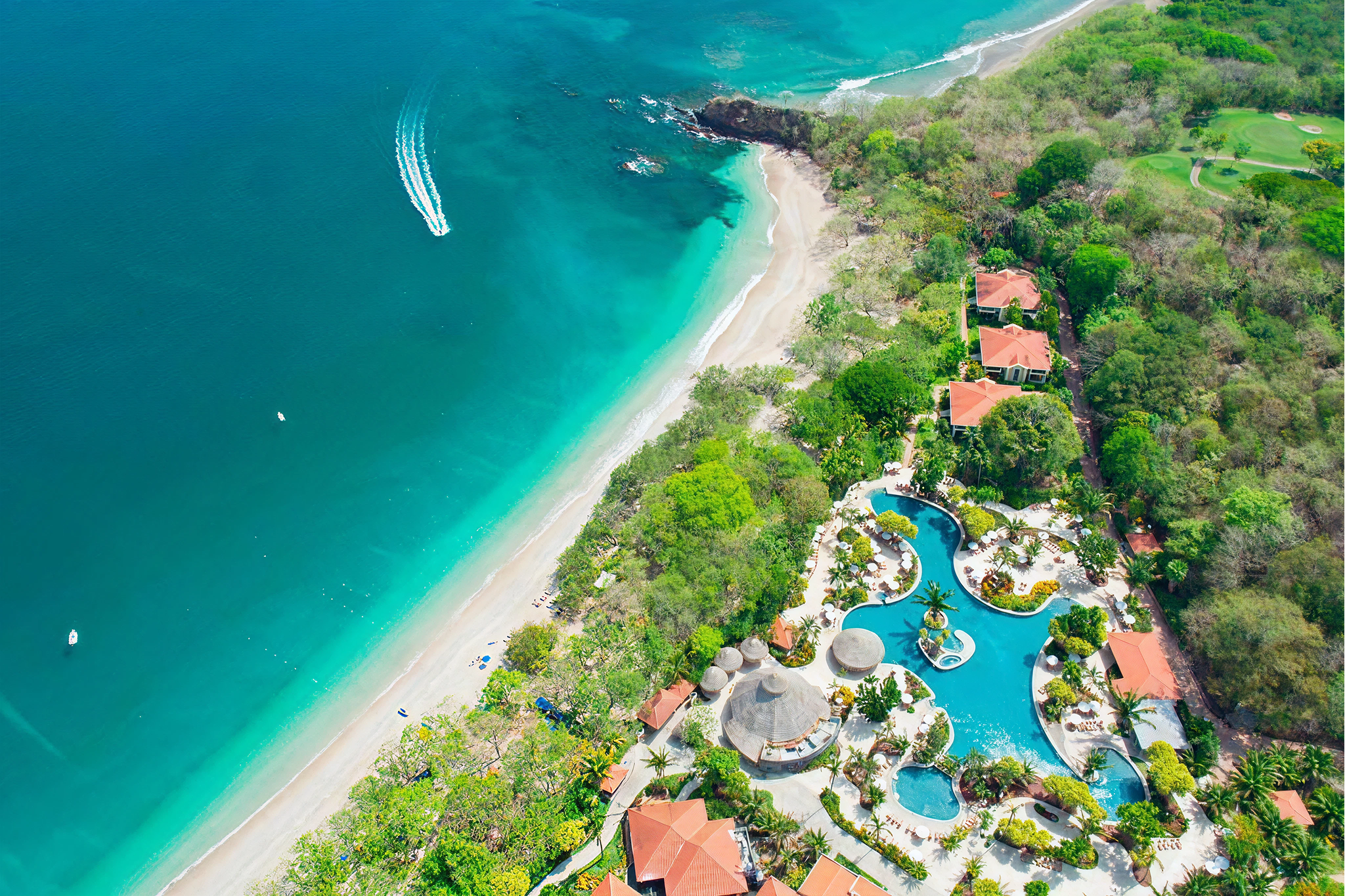 Aerial shot of The Westin Reserva Conchal with turquoise beachfront and lagoon-style pools—considered one of the best beach hotels in Costa Rica for all-inclusive stays and golf access.