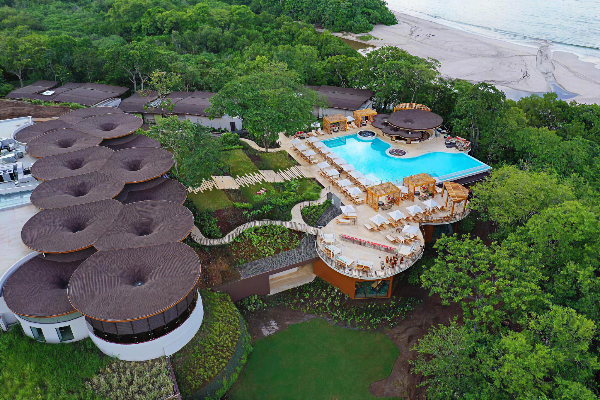Drone view of W Costa Rica’s pool area and direct beach access at Playa Conchal—among the best beach hotels in Costa Rica for vibrant design and modern amenities.