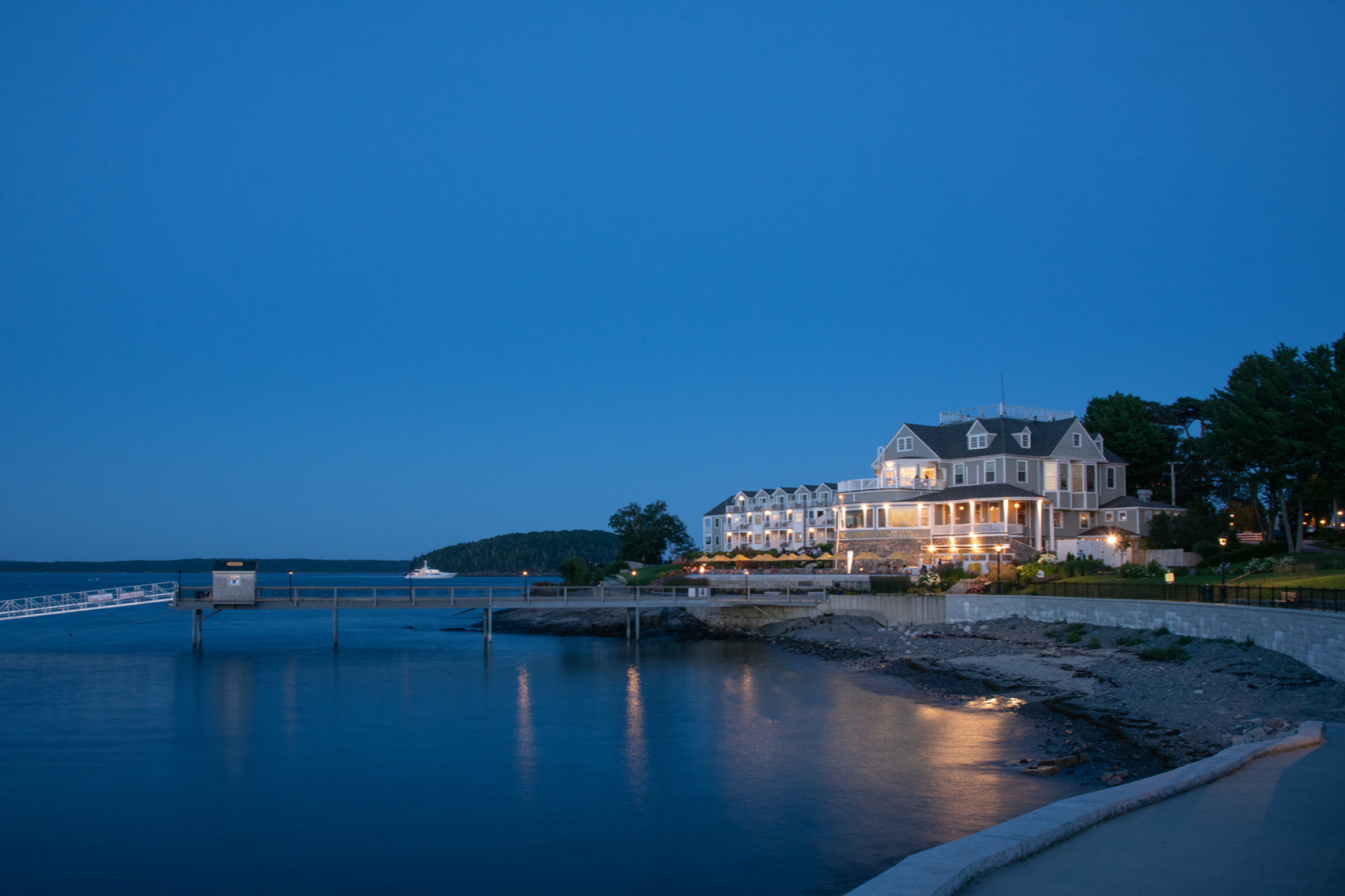 Evening waterfront view of Bar Harbor Inn in Maine — a New England favorite among the best luxury beach resorts in the United States.