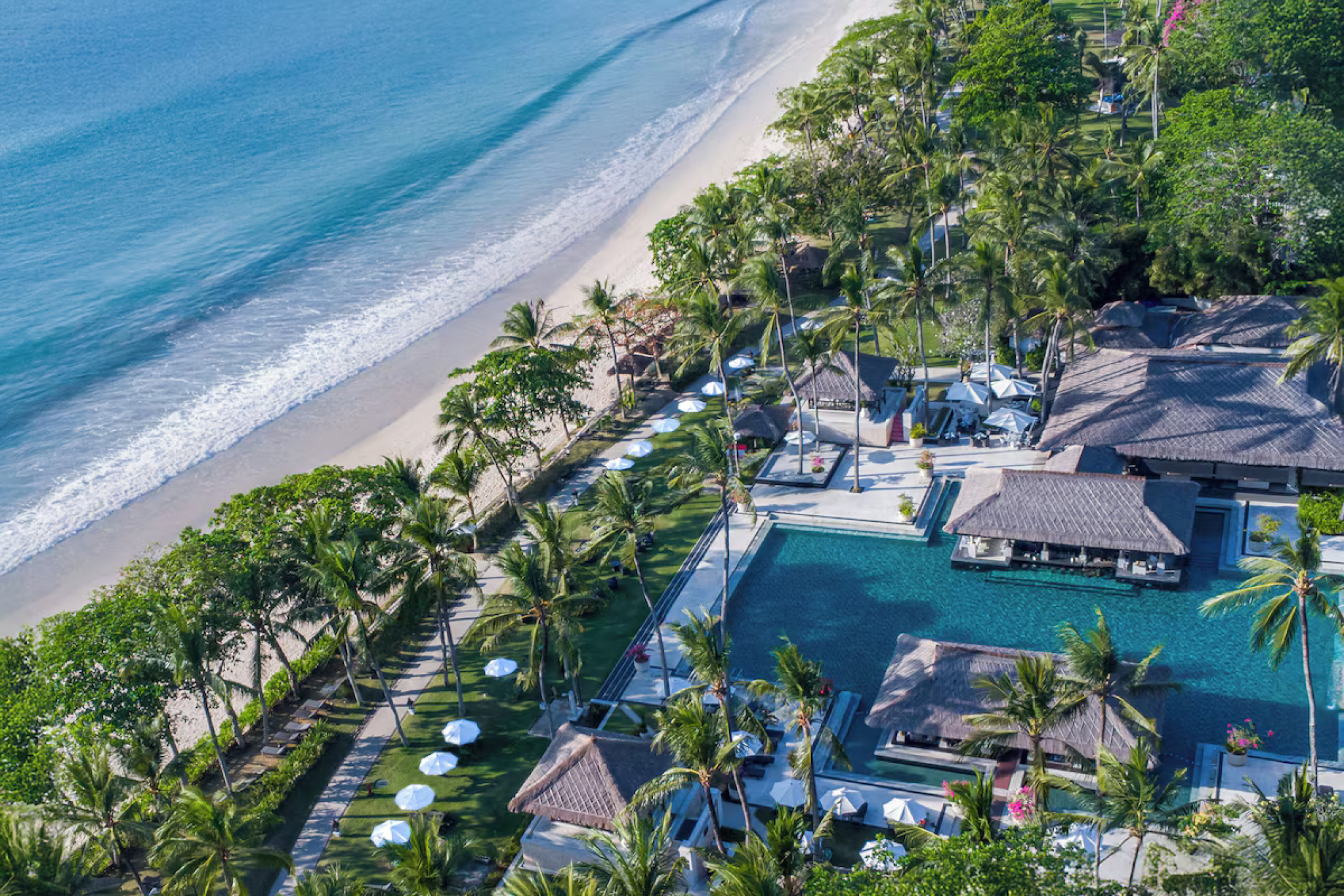 InterContinental Bali Resort overlooking Jimbaran Bay with expansive tropical gardens, beachfront pools, and sunset views, ranked as one of the best beach resorts in Bali