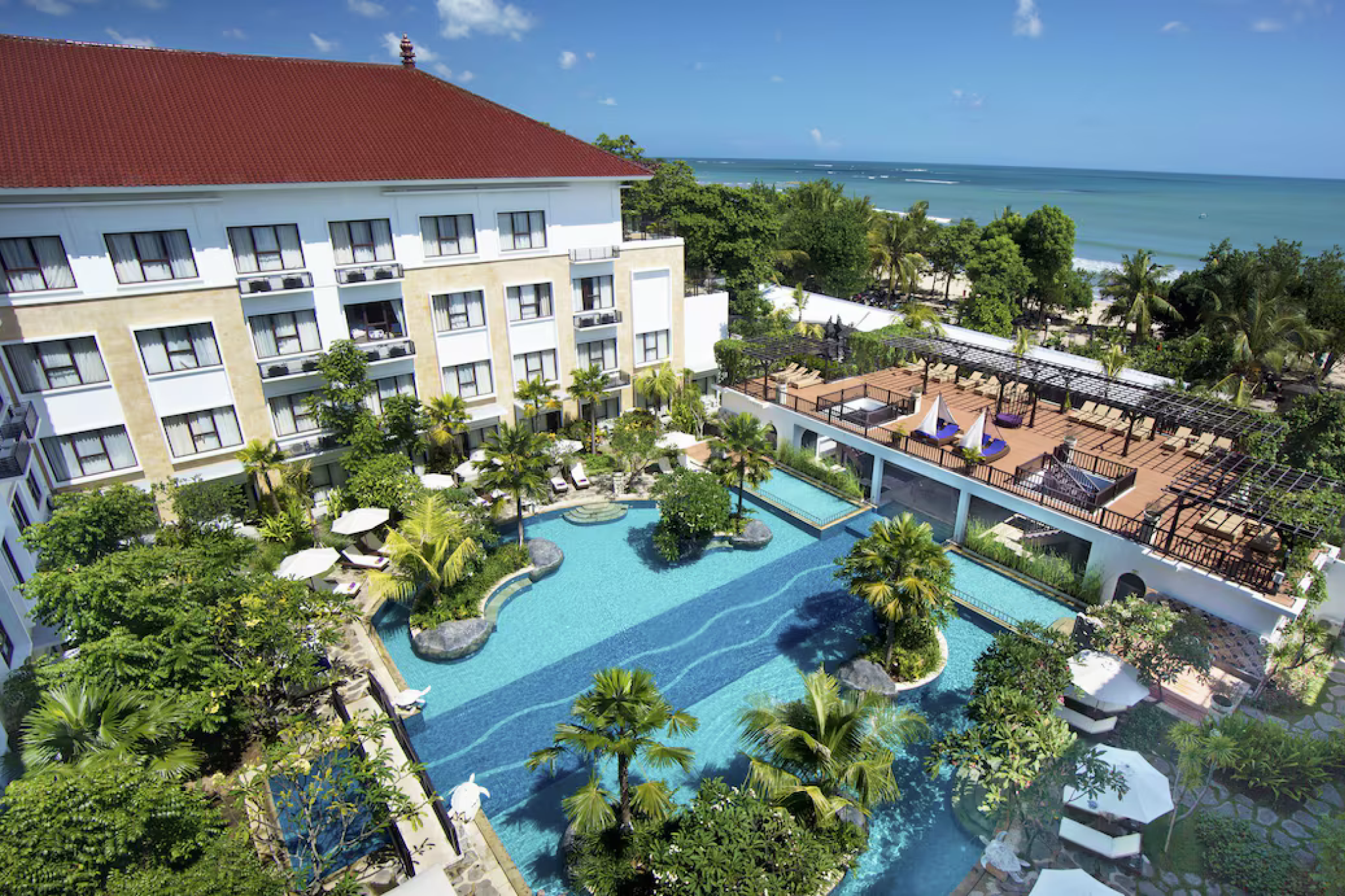 Beachfront view of Truntum Kuta, one of the best beach resorts in Bali with lush gardens and ocean access