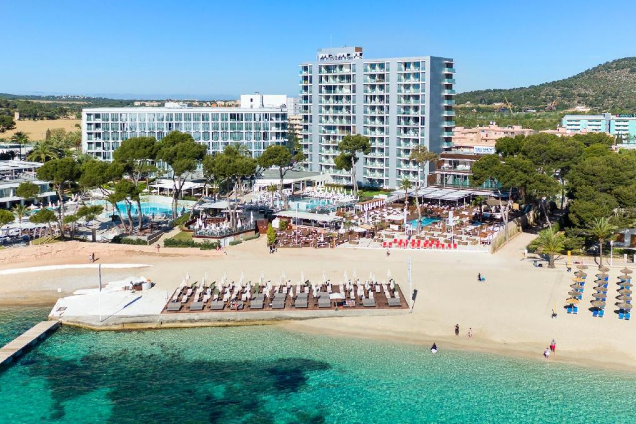 Stunning beachfront resort image of Iberostar Waves Playa de Muro with a panoramic sea view, large pool area, and vibrant setting — consistently rated among the best beach resorts in Mallorca.