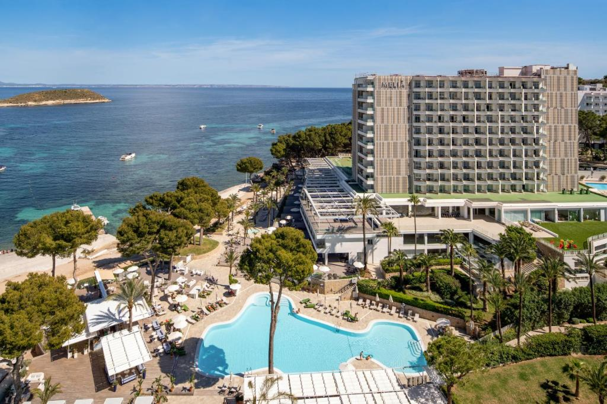 Wide-angle shot of MLL Palma Bay Club Resort with multiple pools, terraces, and loungers near El Arenal beach — a top pick among the best beach resorts in Mallorca for budget-conscious travelers.