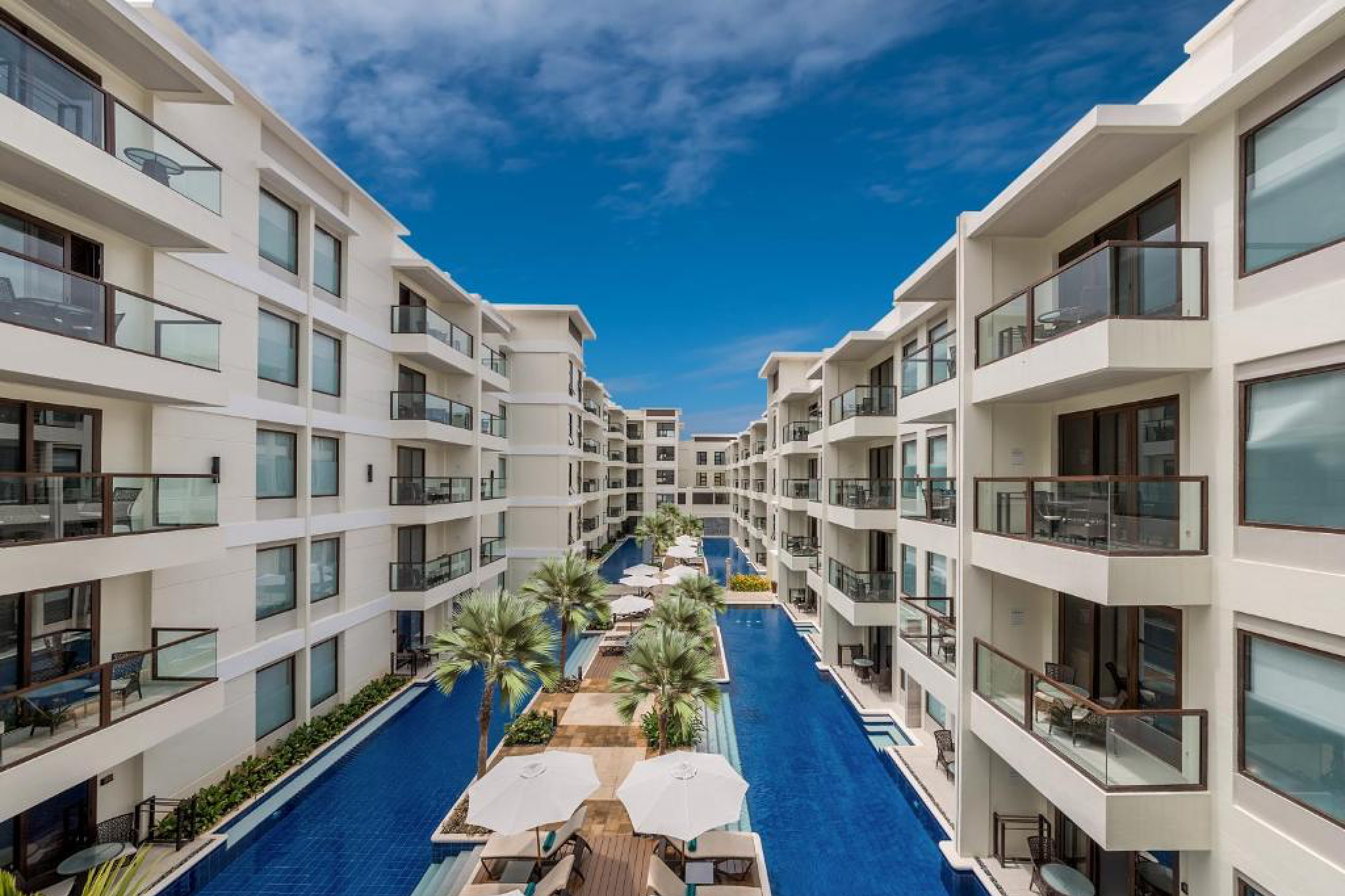 Elegant beachfront suites and central pool at Henann Prime Beach Resort, a top contender for the best beach resorts in the Philippines.