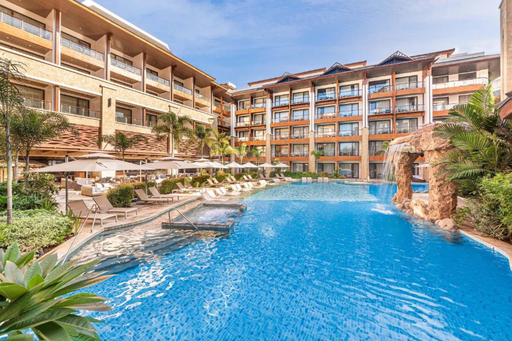 Contemporary resort design and tropical landscaping at Mandarin Bay Resort & Spa, one of the best beach resorts in the Philippines.
