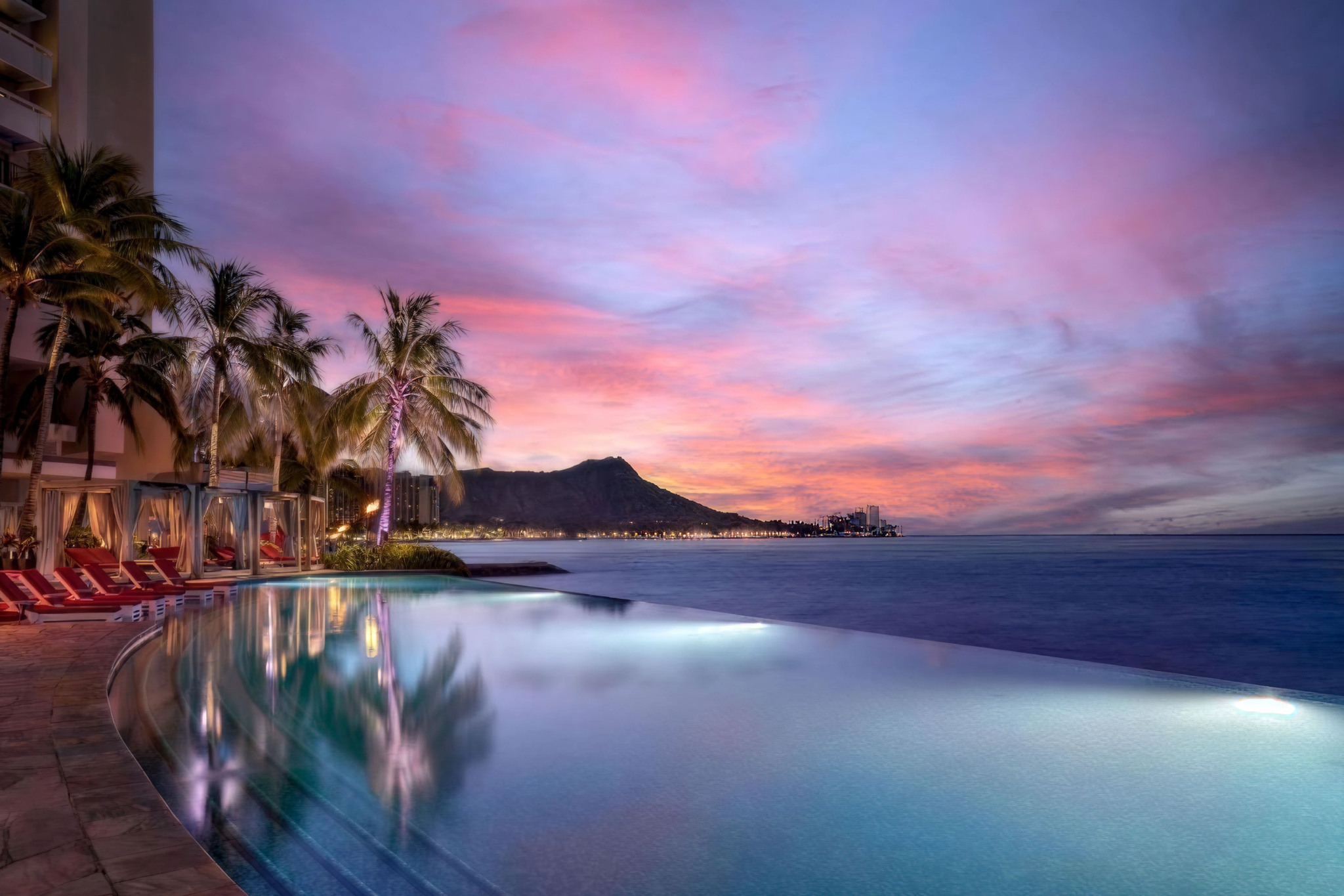 Sheraton Waikiki infinity pool at sunset with Diamond Head view and cabanas, bold resort among best beachfront hotels in Waikiki
