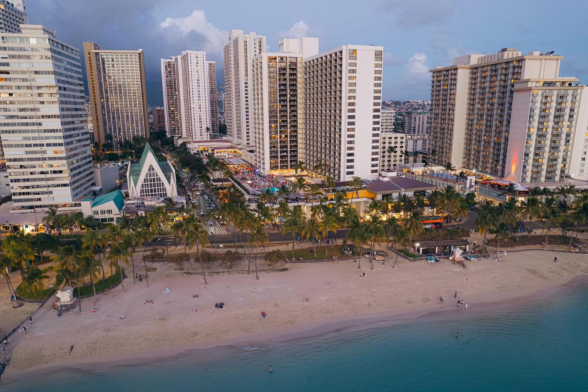 Waikiki Beach Marriott Resort aerial view showing beachfront location and modern towers, polished luxury best beachfront hotels in Waikiki