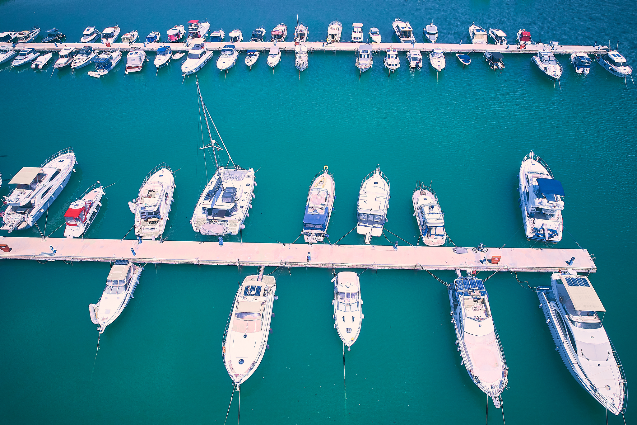 Vibrant aerial view of a bustling marina — where the best boat names turn every vessel into a standout.