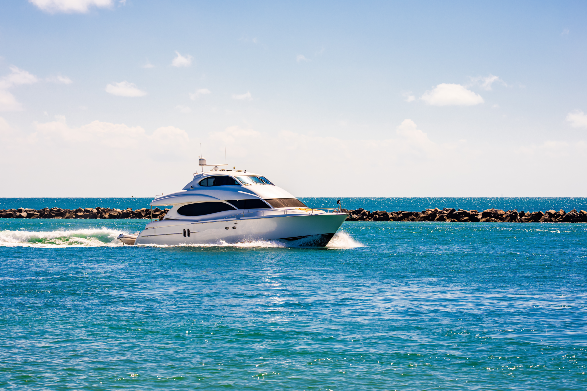Modern yacht gliding through blue water — a bold backdrop for cool and confident best boat names.
