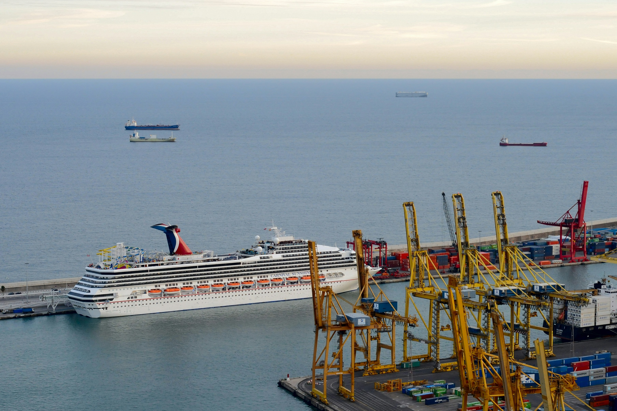 Twilight view of cruise ships docked in Barcelona’s bustling port, illustrating efficient facilities, city access, and Mediterranean charm, solidifying its position as the top-ranked best cruise port in 2025.