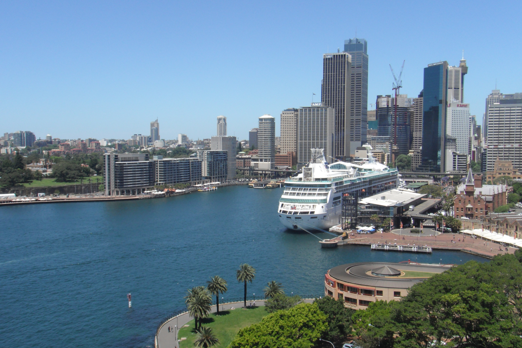 Cruise ship docked at Sydney harbor with the modern skyline in the background, illustrating seamless access to iconic landmarks and urban experiences, a leading destination in the best cruise ports in 2025.