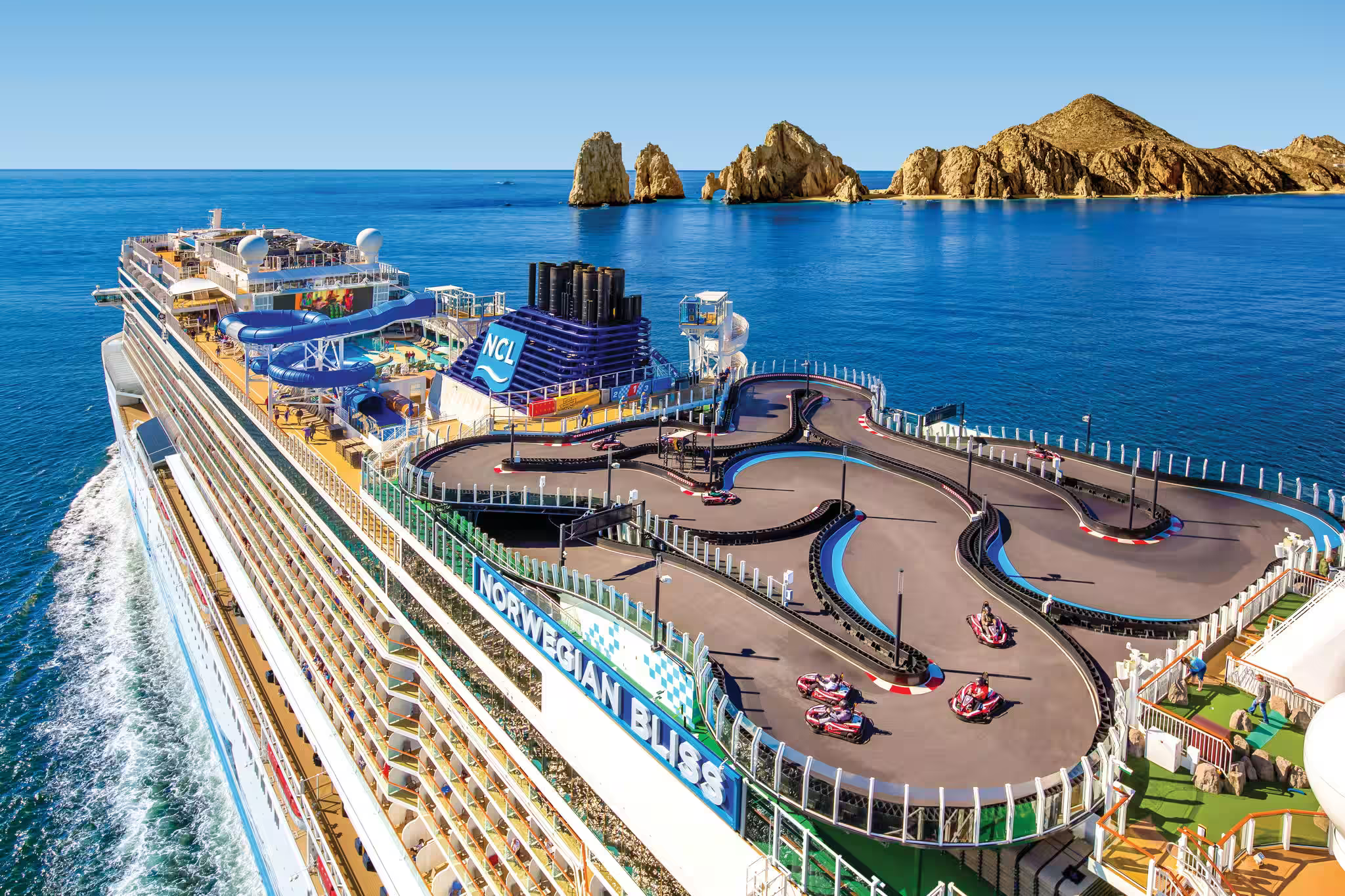 Norwegian Cruise Line ship with a rooftop go-kart track and waterslides, combining high-energy fun and flexibility — one of the Best Cruises for Families.
