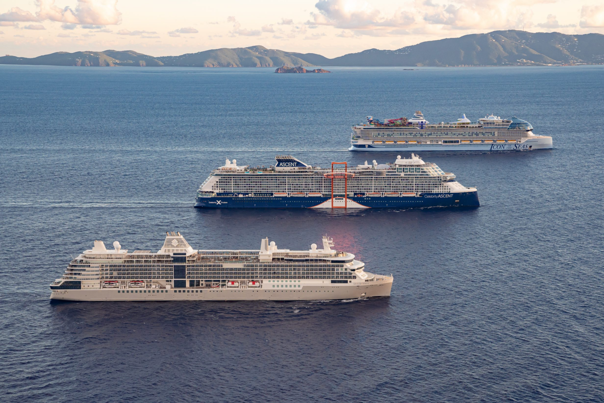 Royal Caribbean International ships sailing together on tropical waters, featuring innovative attractions and adventure-filled voyages — among the Best Cruises for Families.