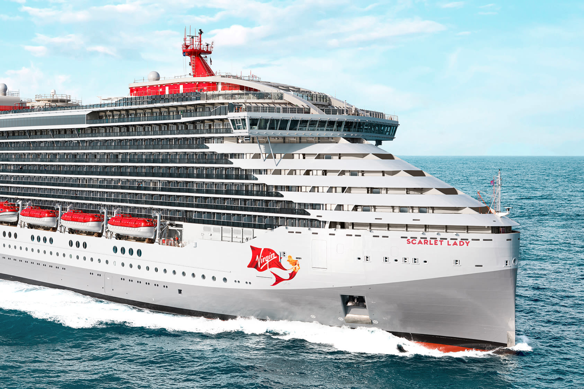 Virgin Voyages Scarlet Lady cruising in open waters with sleek red accents and modern design — a top pick among the Best Cruises for Honeymoon travelers looking for adults-only sophistication and energy.