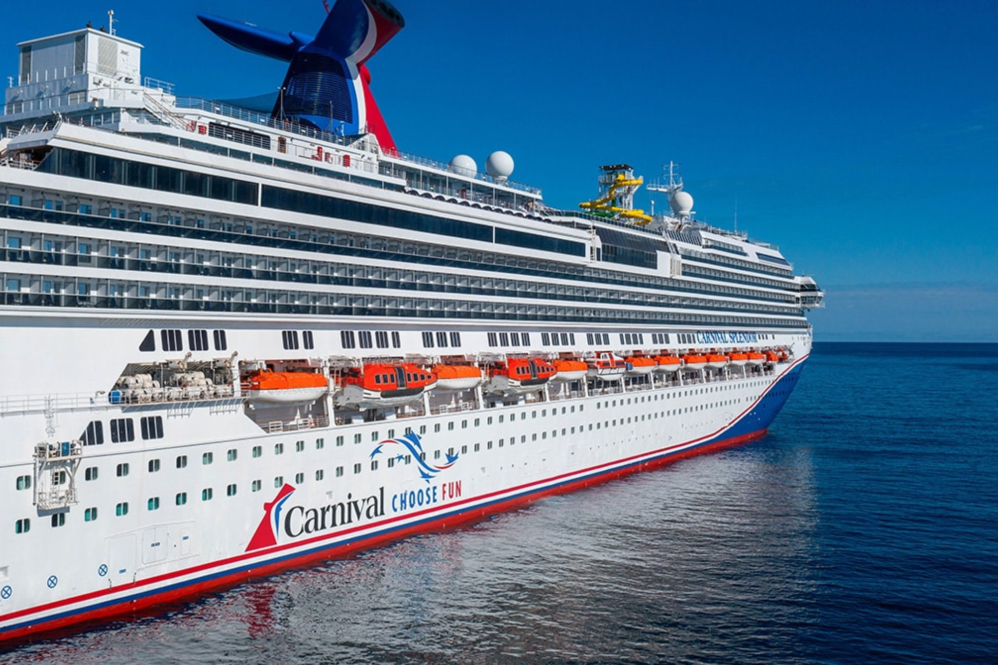 Carnival cruise ship sailing under a clear blue sky — a top choice among the best cruises for partying with vibrant deck celebrations and endless onboard entertainment.