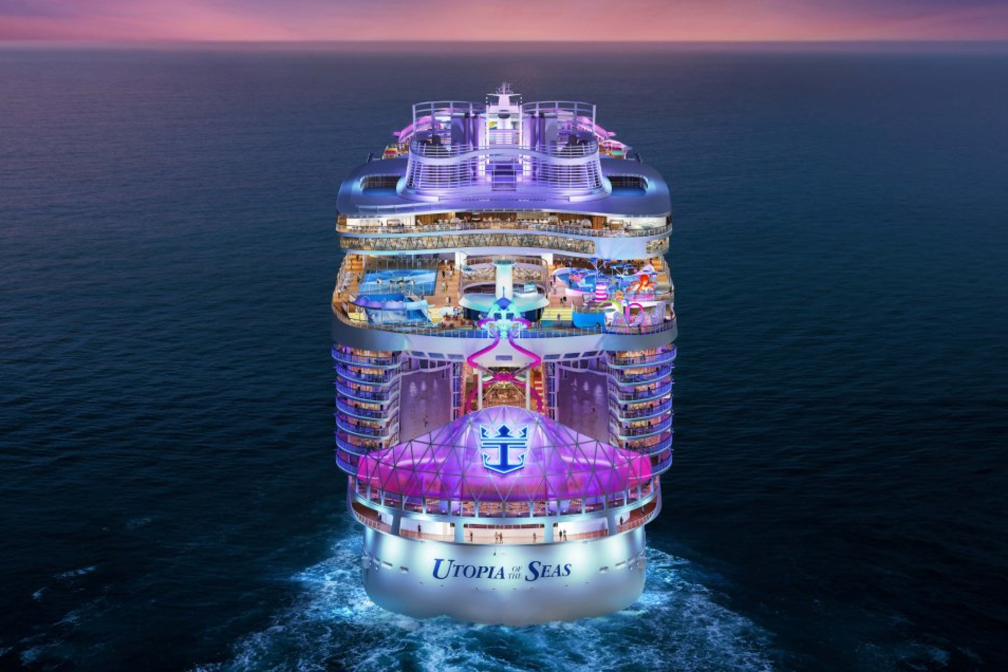 Rear view of Royal Caribbean’s Utopia of the Seas glowing with lights — representing one of the best cruises for partying on the world’s largest and most energetic ships.