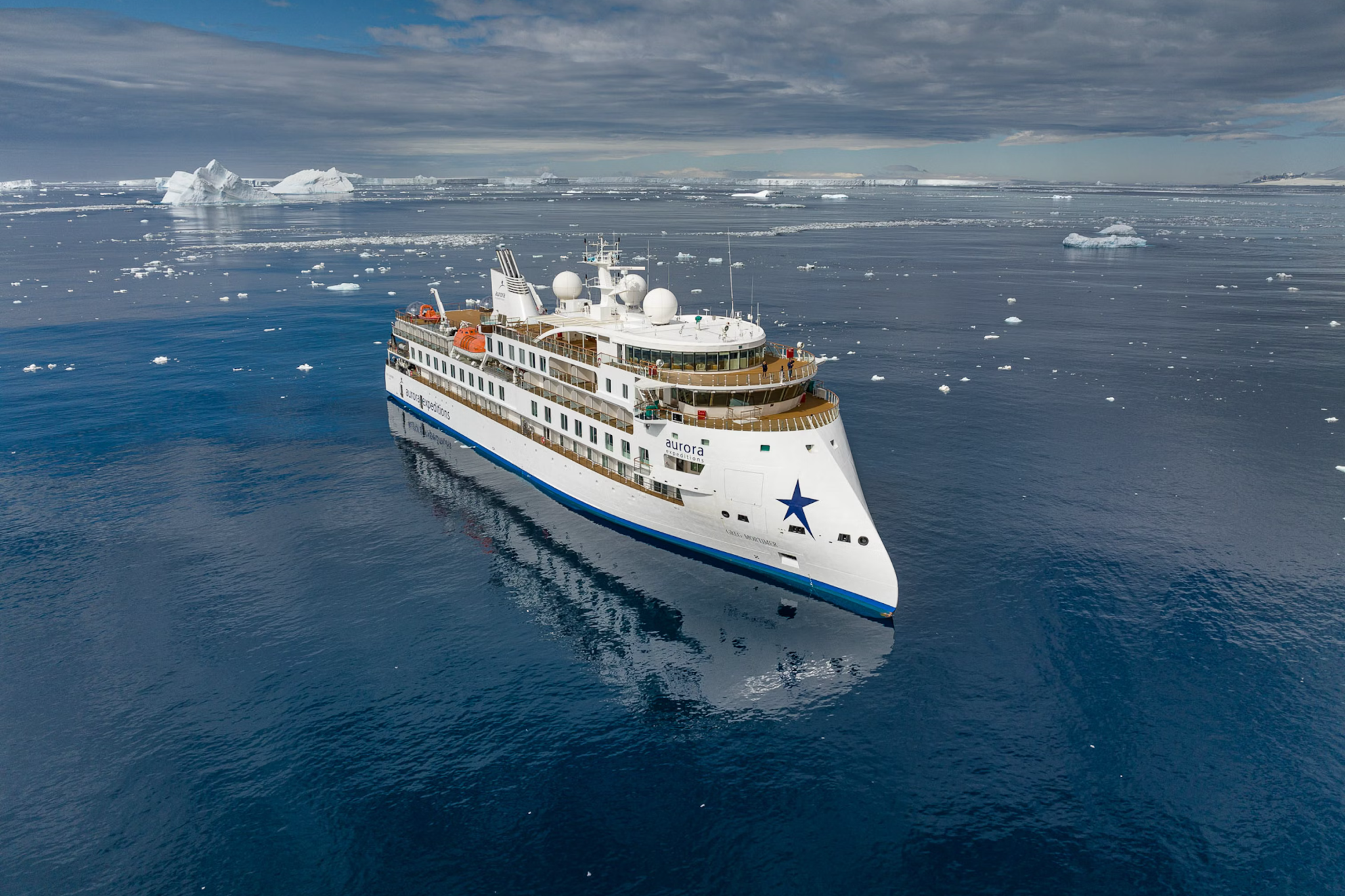 Aurora Expeditions’ Greg Mortimer ship in remote polar seas, demonstrating small-group adventure that secures its reputation as one of the best expedition cruise lines.