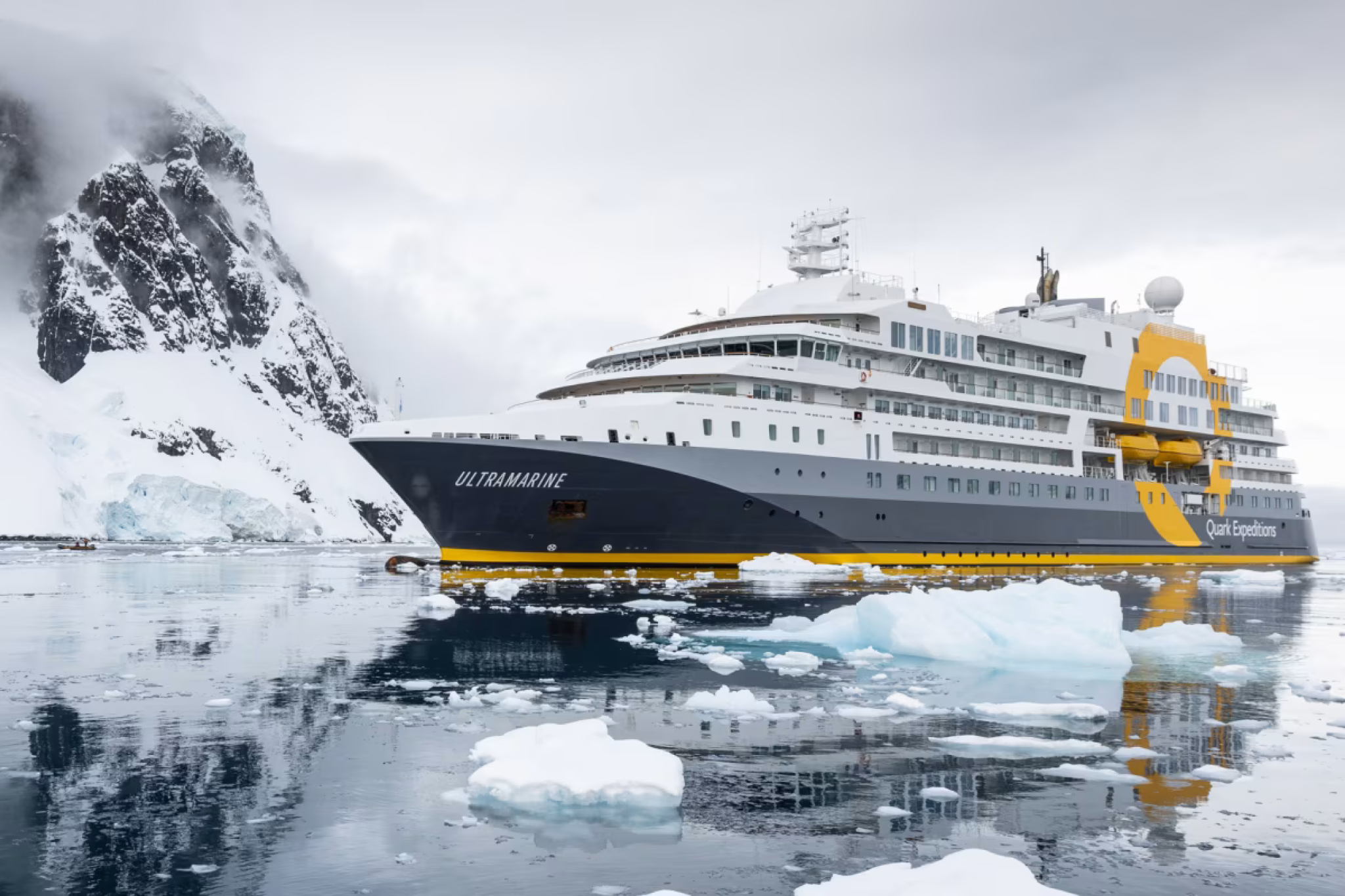 Quark Expeditions’ Ultramarine surrounded by Antarctic ice, designed for adventure-first travel that makes it one of the best expedition cruise lines.
