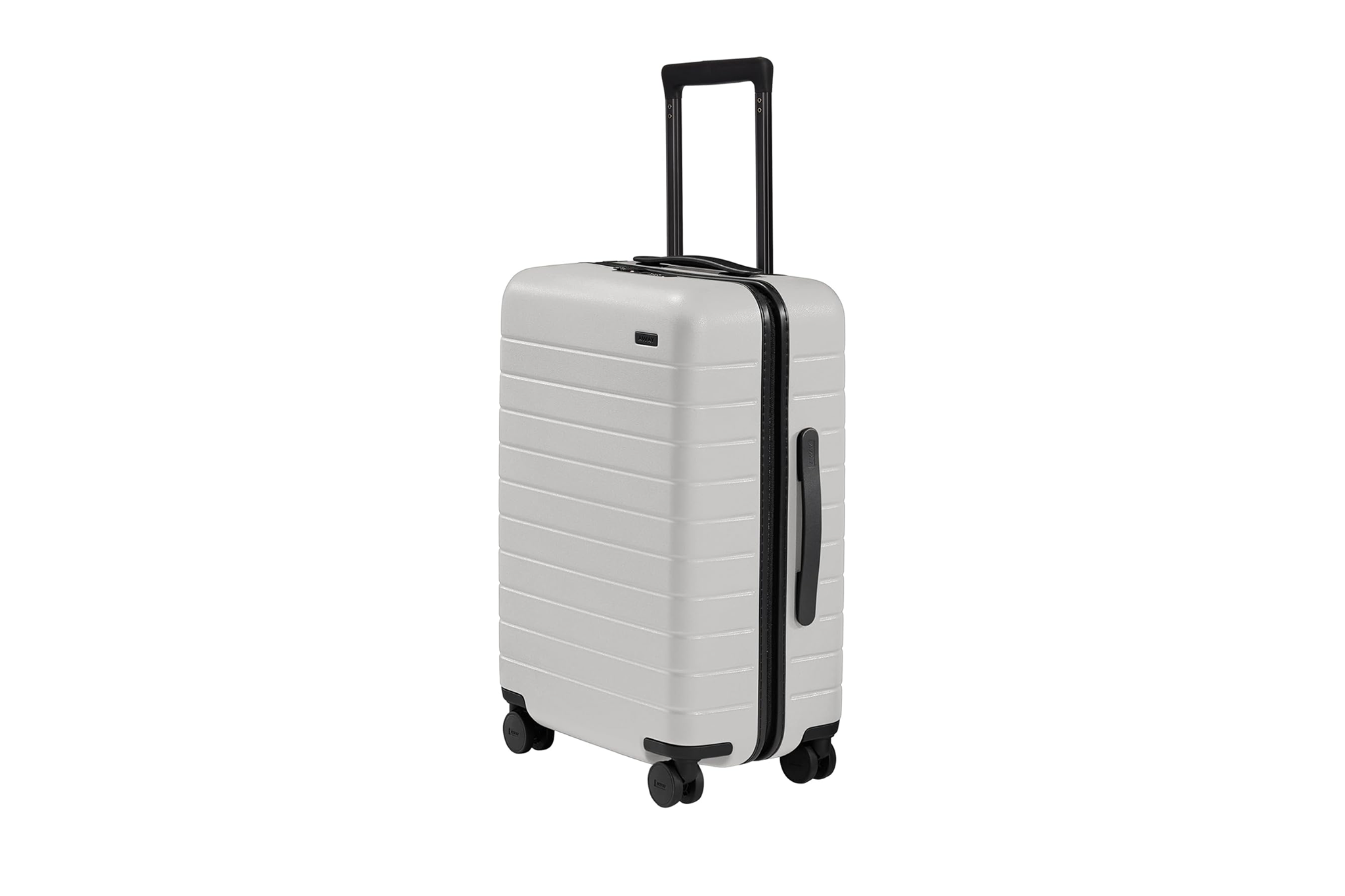 Away The Bigger Carry-On in navy with front pocket and minimalist shell, recognized as one of the best luggages for performance, design, and reliability.