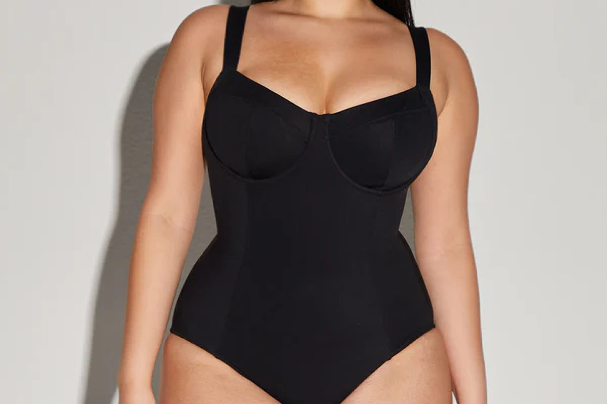 Close-up of a woman in the TA3 Lifty One-Piece Swimsuit featuring underwire cups and wide straps, designed for enhanced support and waist shaping – one of the best one-piece swimsuits for large busts.