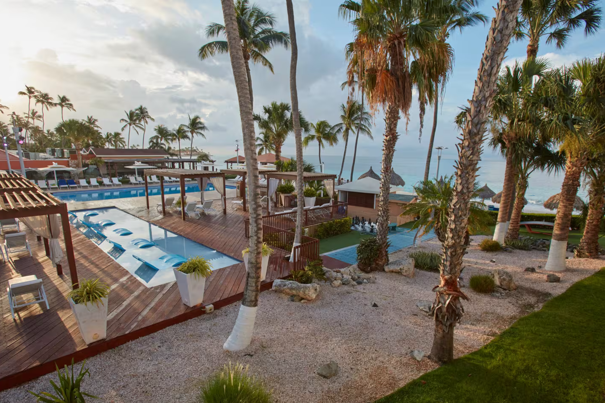 Divi Aruba All Inclusive, among the best resorts in Aruba, with ocean-view pools, beachfront cabanas, and palm-lined pathways on Druif Beach.