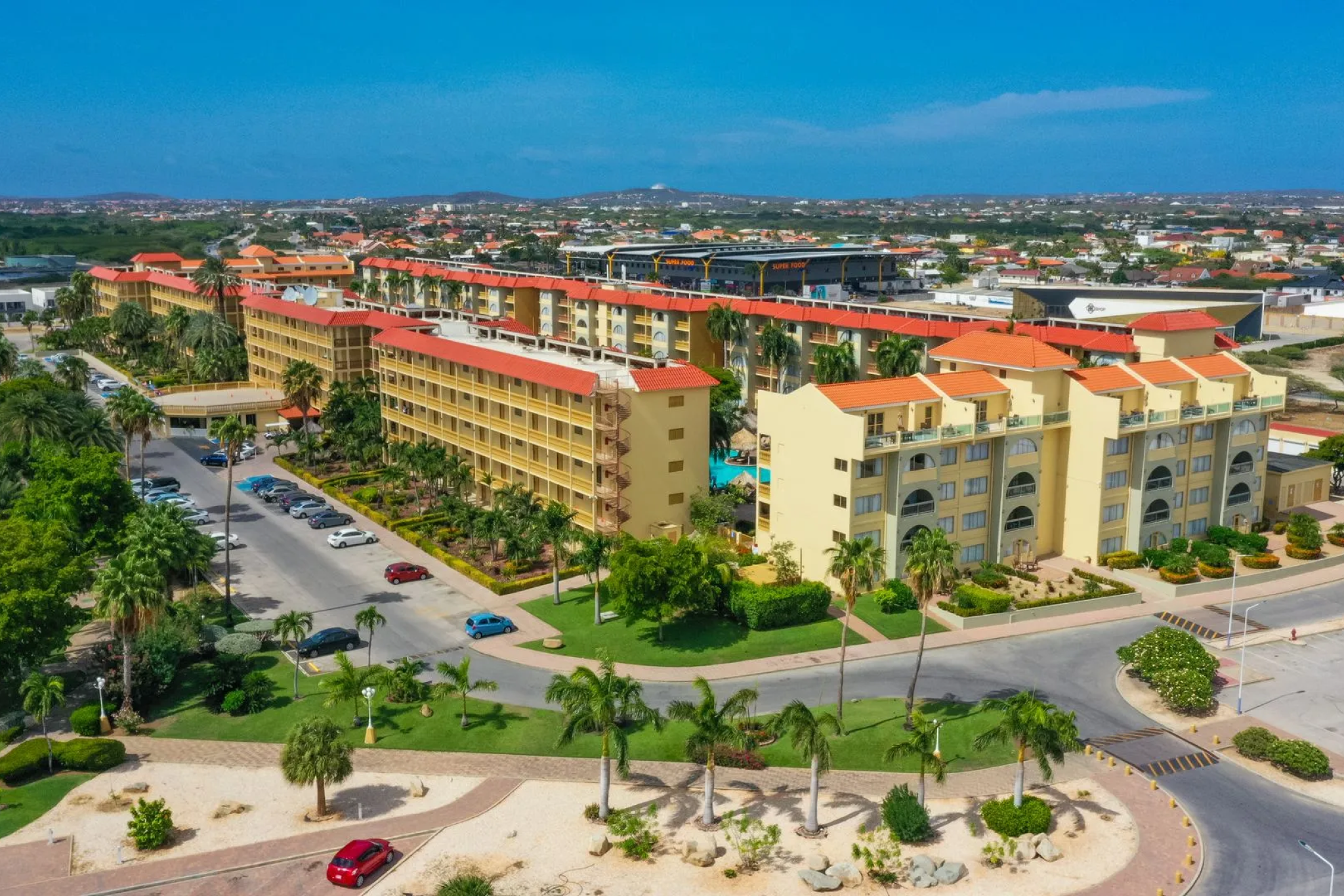 Eagle Aruba Resort, one of the best resorts in Aruba near Eagle Beach, with terracotta roofs, multiple pools, and a relaxed residential-style layout.