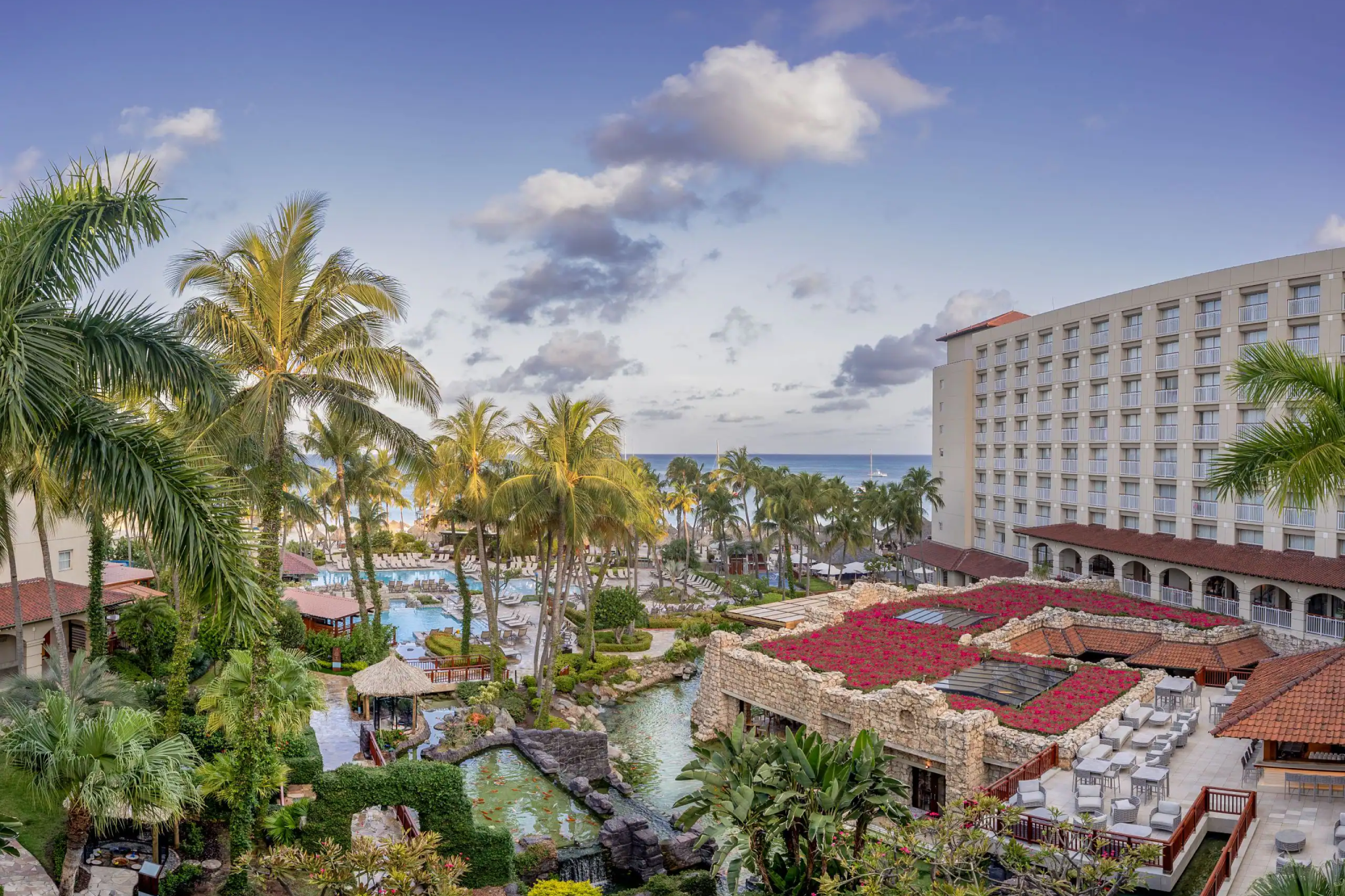 Hyatt Regency Aruba Resort Spa & Casino, ranked among the best resorts in Aruba, with tropical gardens, cascading pools, and ocean views along Palm Beach.