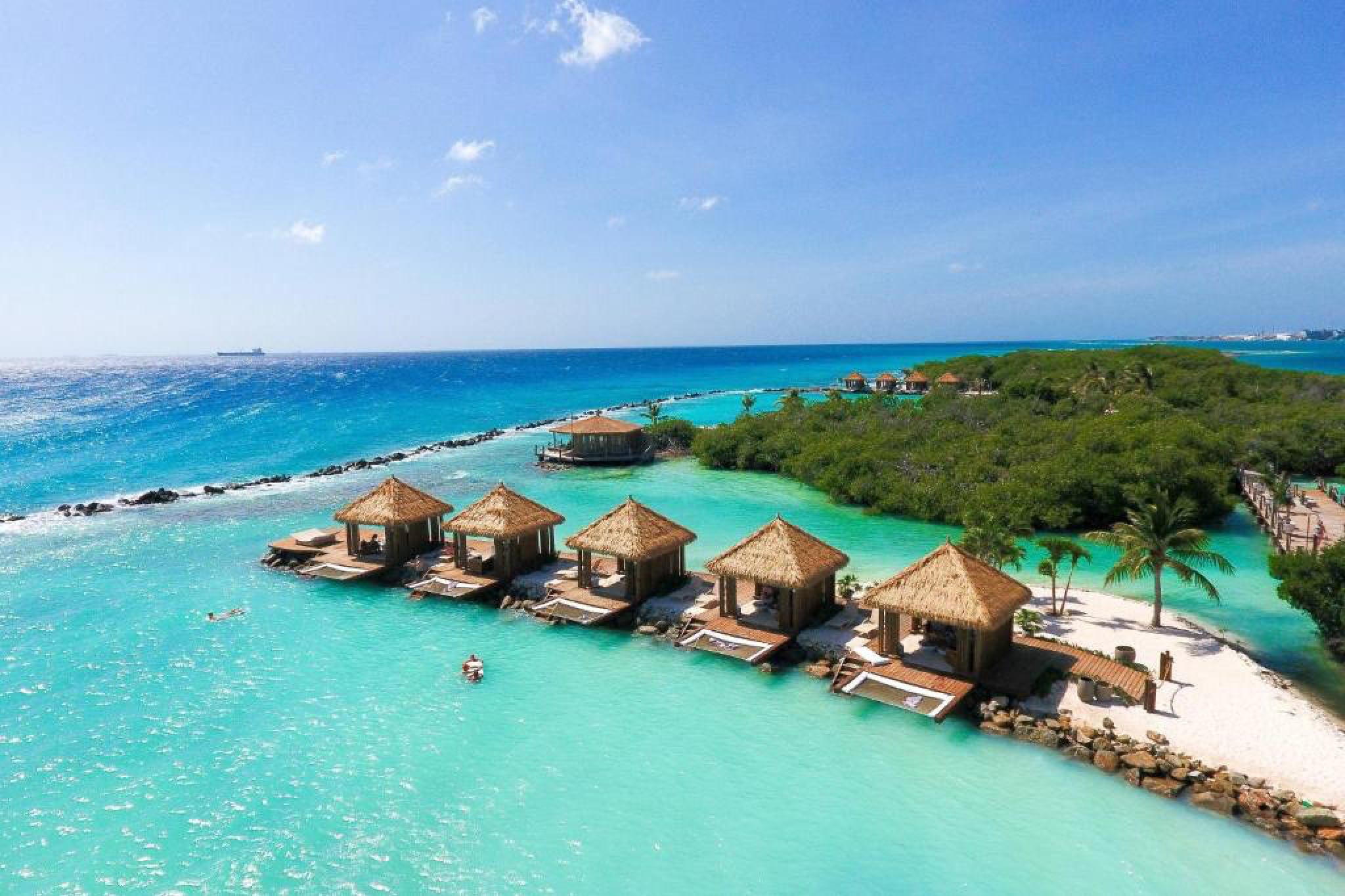 Renaissance Wind Creek Aruba Resort, among the best resorts in Aruba, offering private overwater cabanas on a turquoise lagoon near Oranjestad.