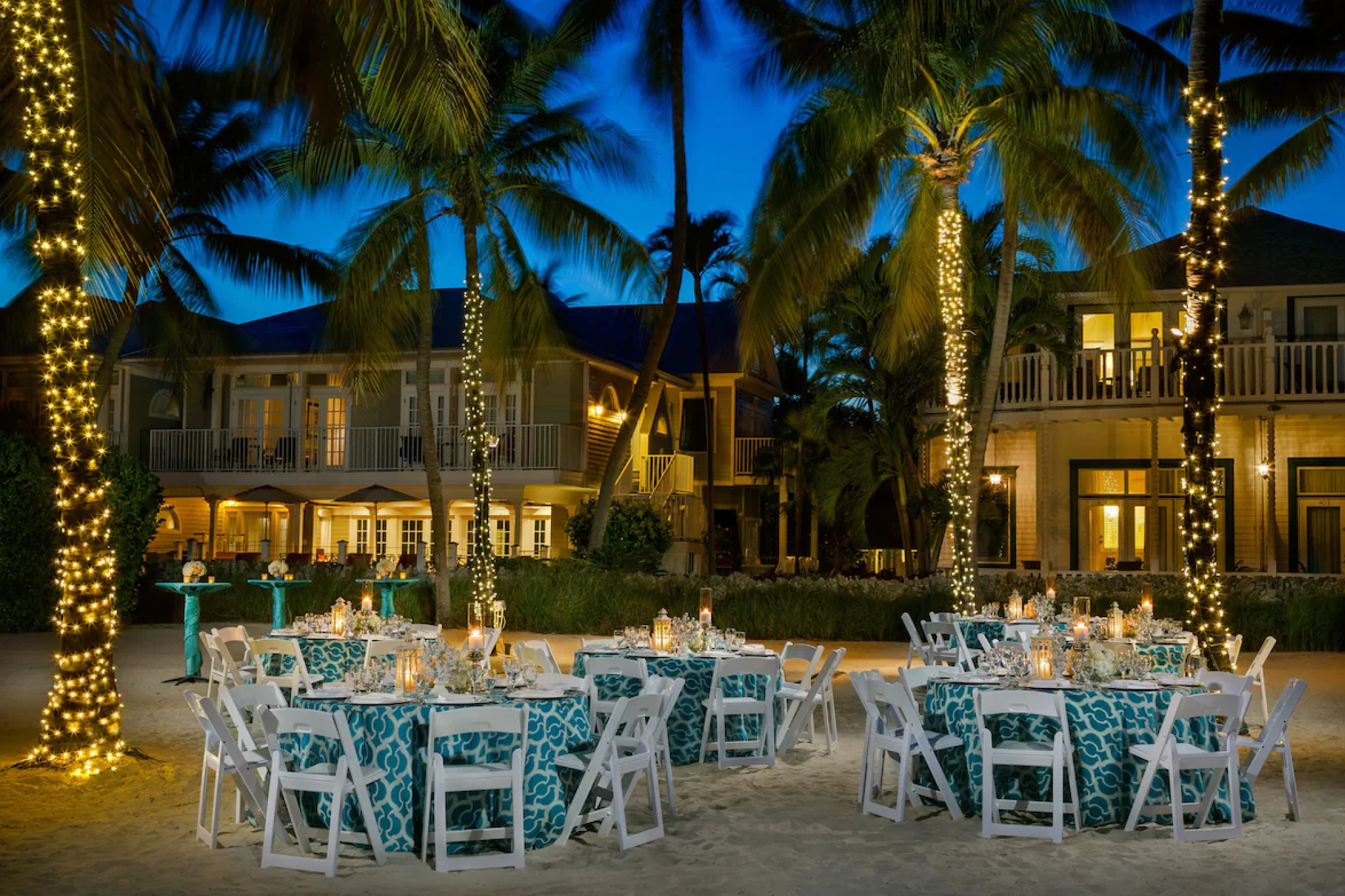 Beachfront dining setup under twinkling lights at Southernmost Beach Resort, one of the best resorts in Florida Keys for a vibrant island experience.