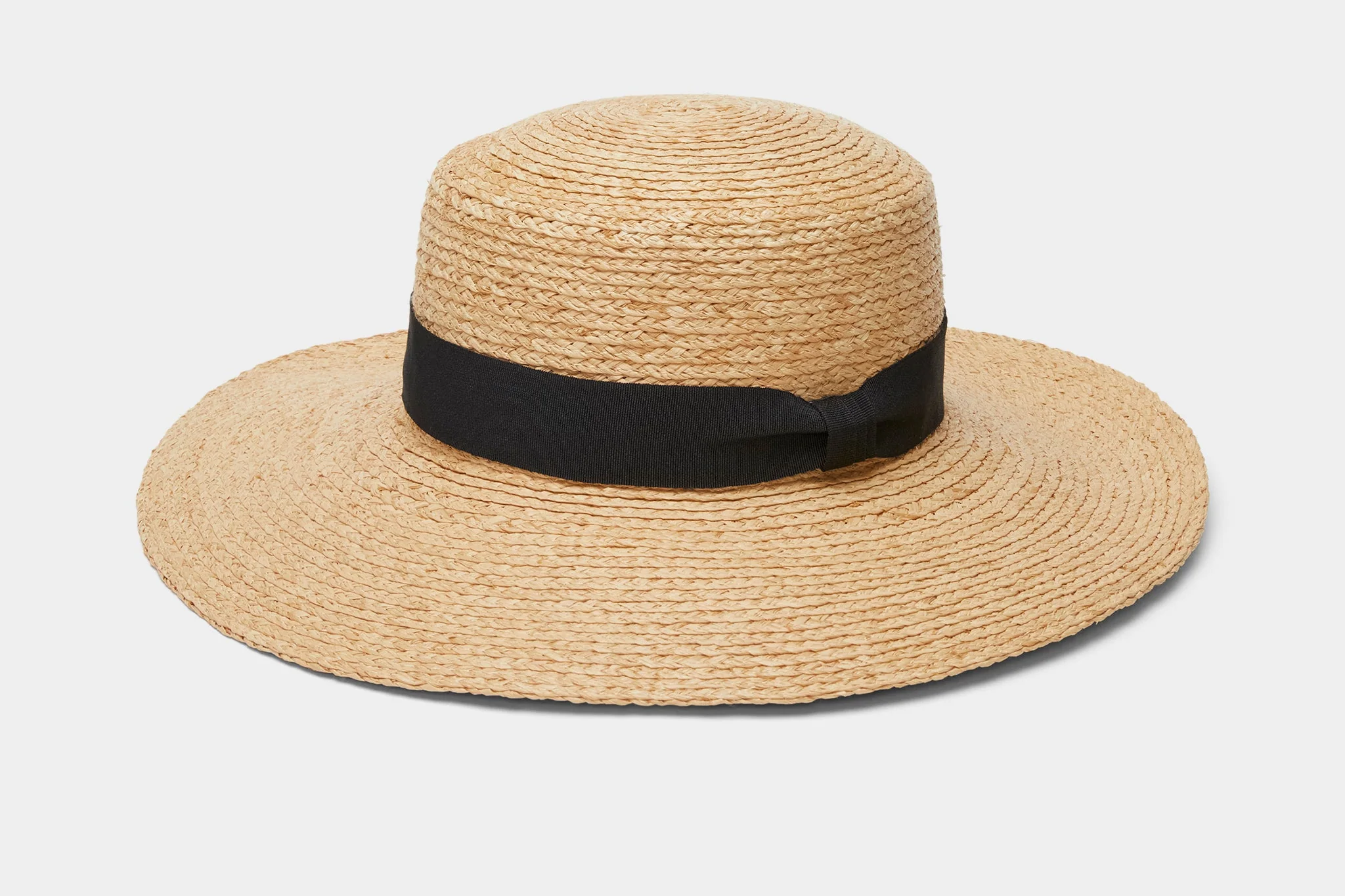 Tilley Raffia Wide Brim Hat handcrafted from natural raffia with black ribbon band, recognized as the best sun hat in 2025 for luxury beach style and superior sun coverage.