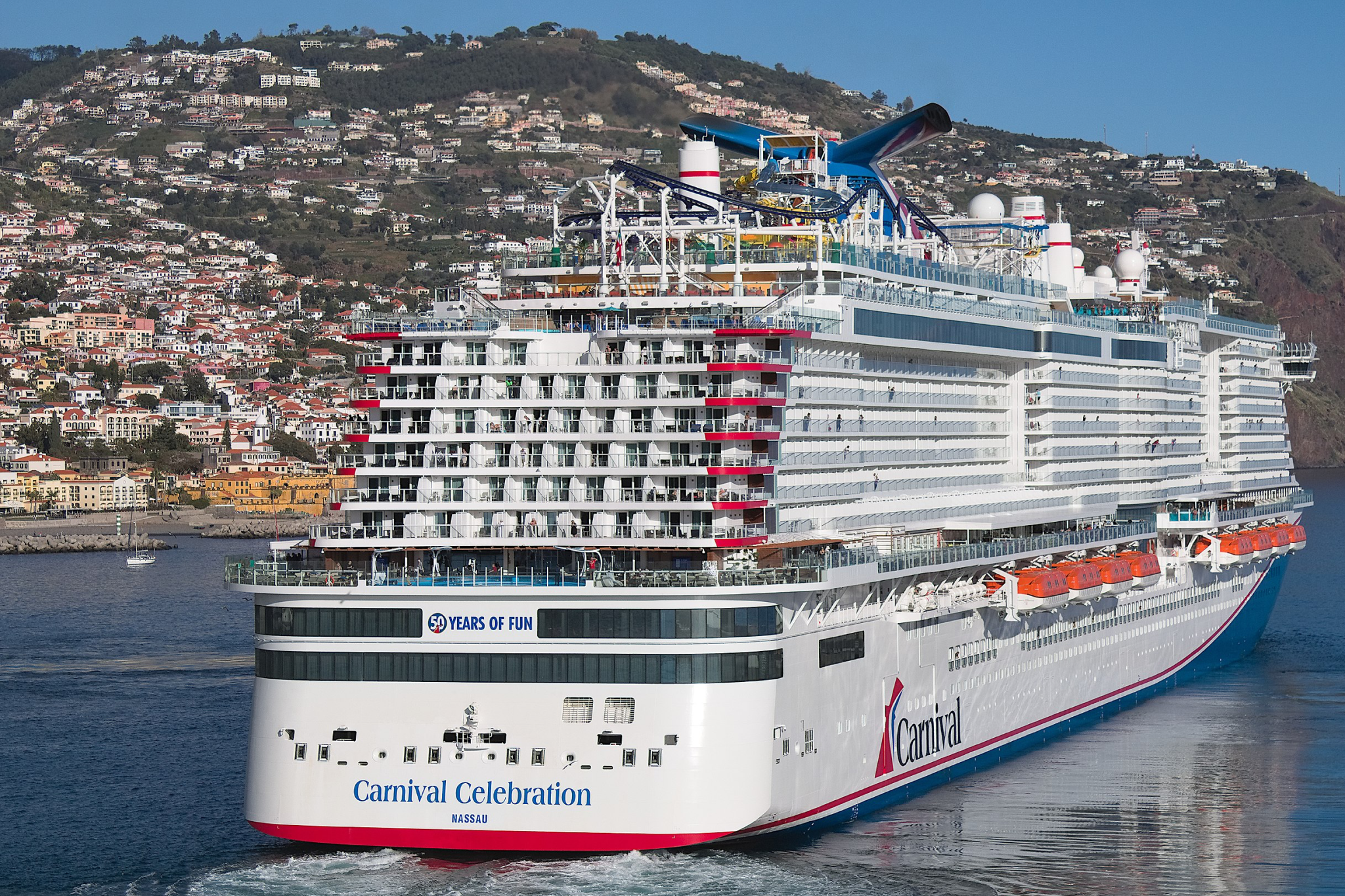Carnival Cruise Lines Ships by Size ranking featuring Carnival Celebration at sea, showcasing its large-scale Excel Class layout with multiple decks, open-air zones, and modern cruise ship design