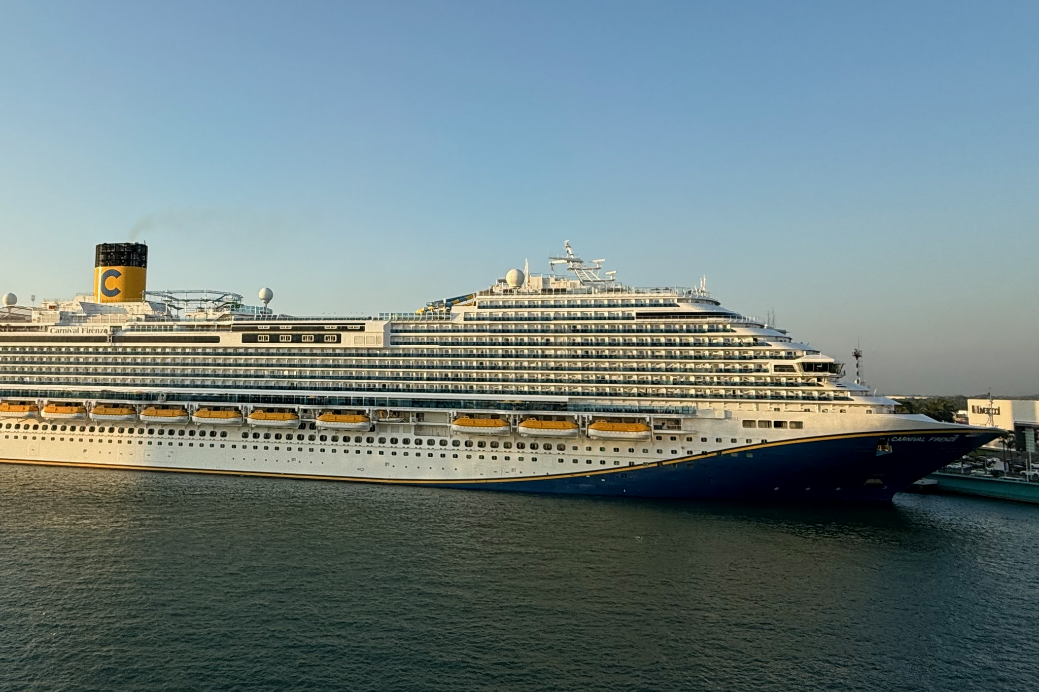 Carnival Cruise Lines Ships by Size visual featuring Carnival Firenze at sea, showing its Venice Class exterior, evenly spaced balconies, and clean, modern superstructure