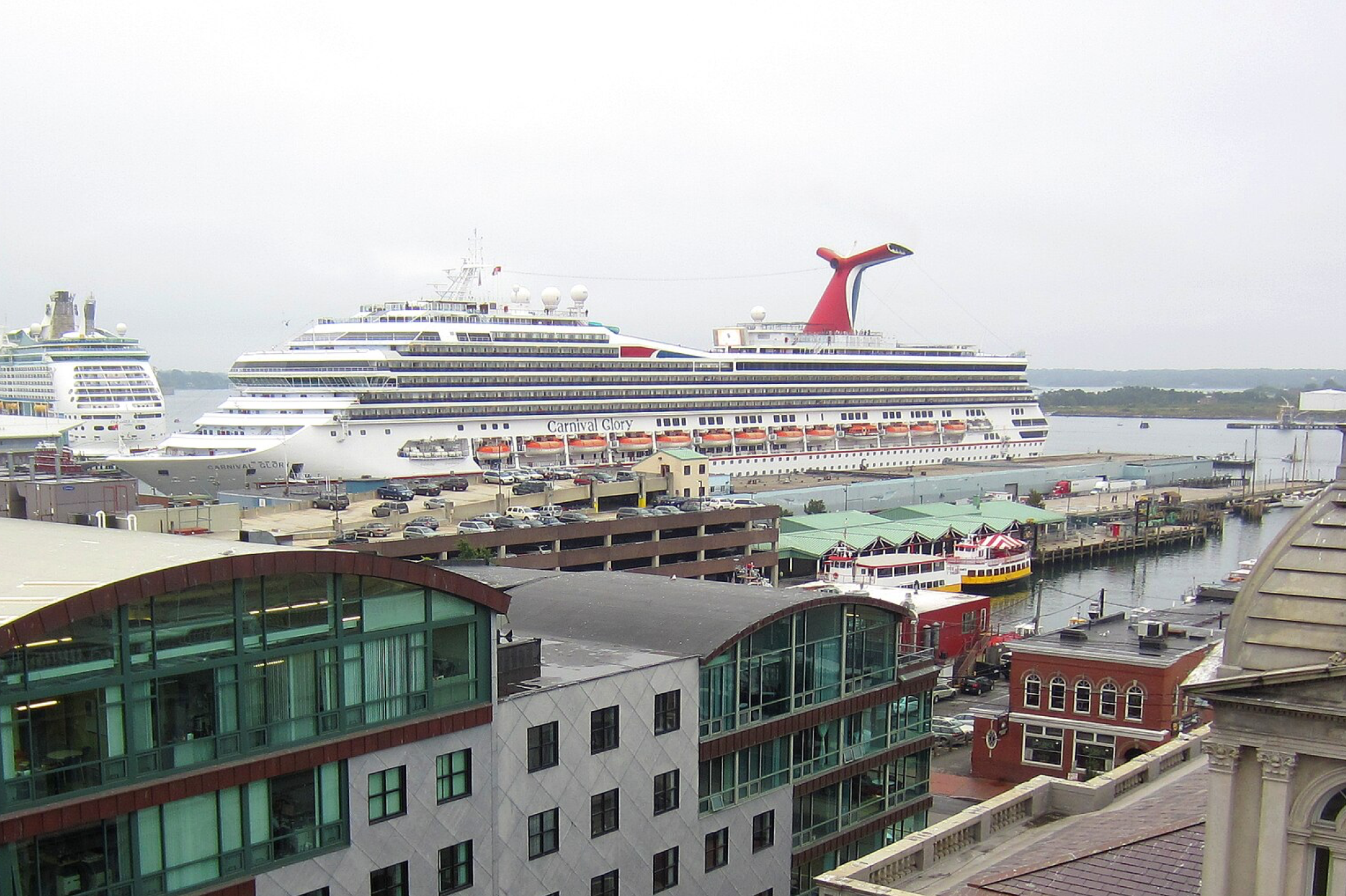 Carnival Cruise Lines Ships by Size visual showing Carnival Glory at sea, highlighting its balanced proportions, open pool deck, and multi-level passenger decks