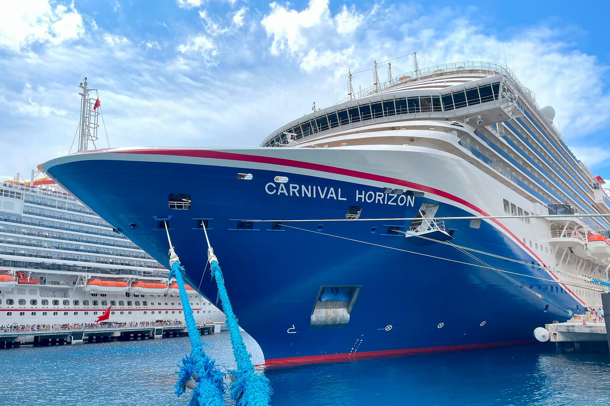 Carnival Cruise Lines Ships by Size image showing Carnival Horizon from an elevated angle, revealing its wide beam, continuous balcony lines, and open-air deck spaces