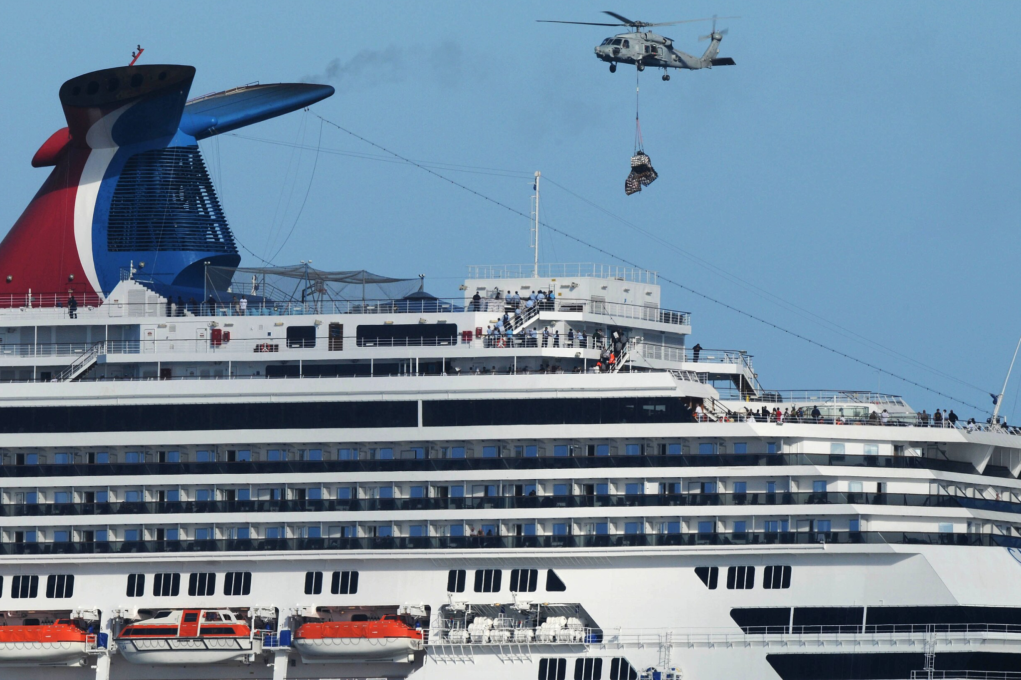 Carnival Cruise Lines Ships by Size visual of Carnival Splendor cruising in open water, highlighting its distinctive superstructure, curved deck lines, and multi-level outdoor areas