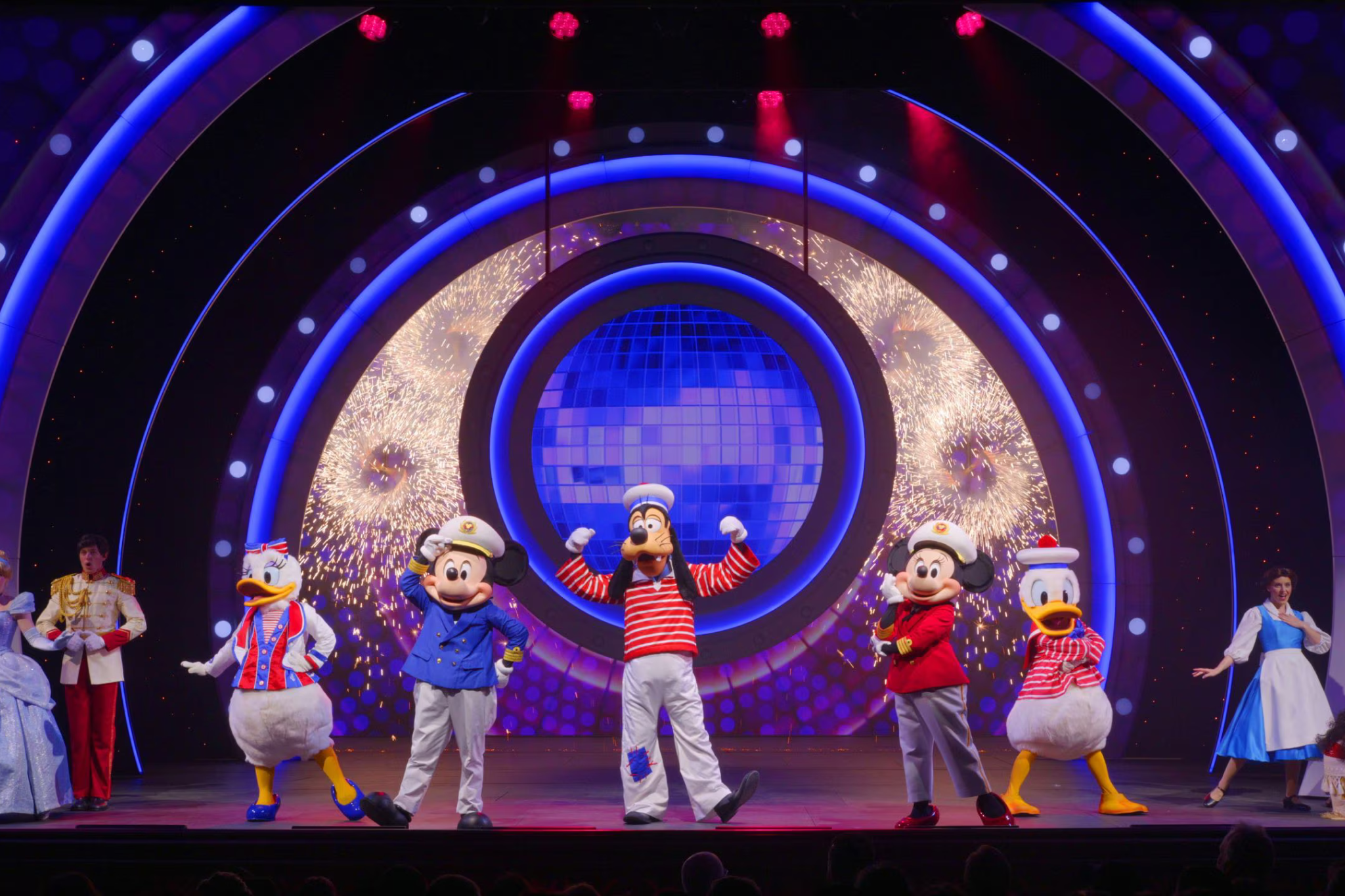 Live stage performance onboard Disney Adventure featuring Disney characters, theatrical lighting, and immersive entertainment for all ages