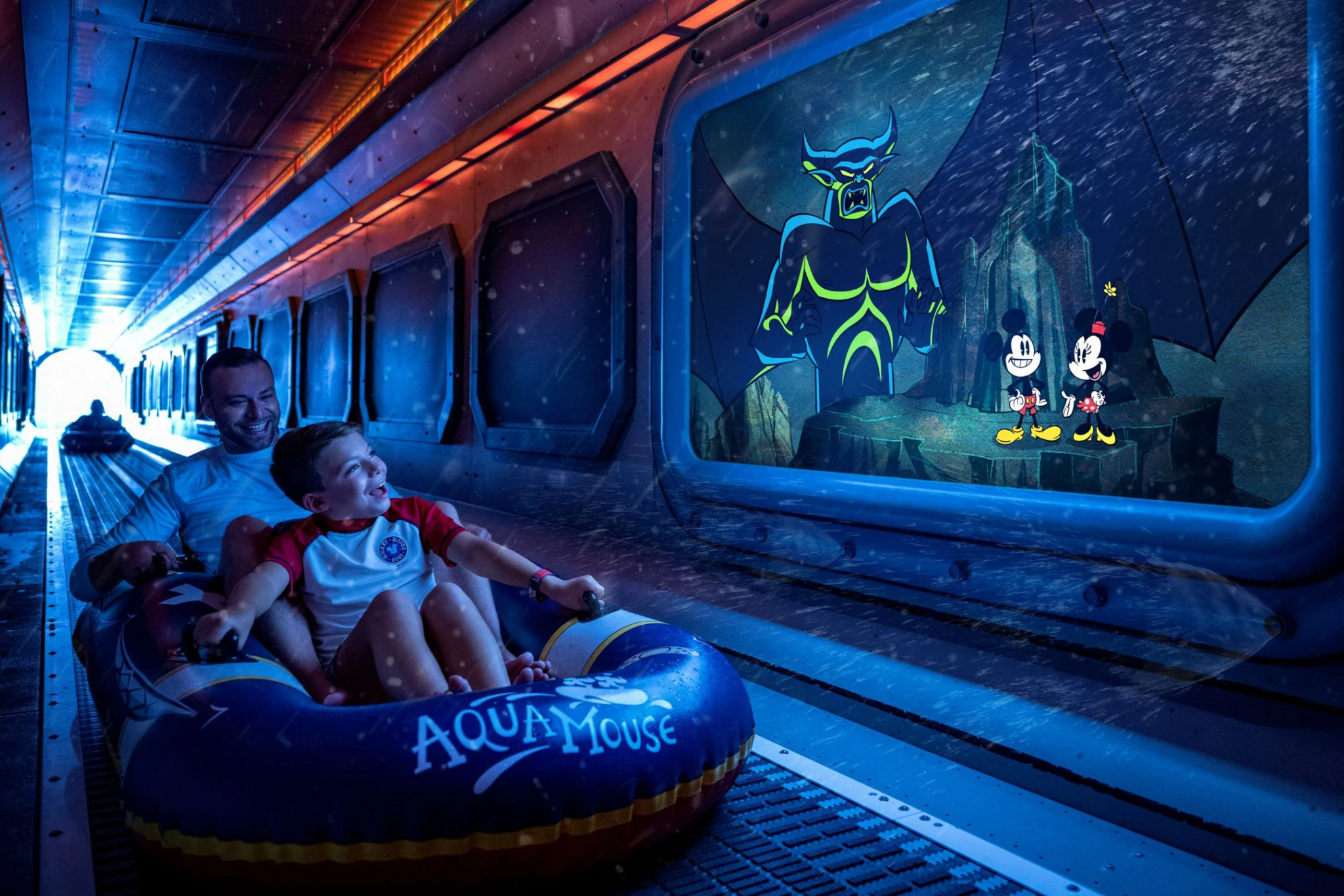 Father and son enjoying the AquaMouse water ride on Disney Destiny, with animated villain scenes playing on-screen inside the tunnel.