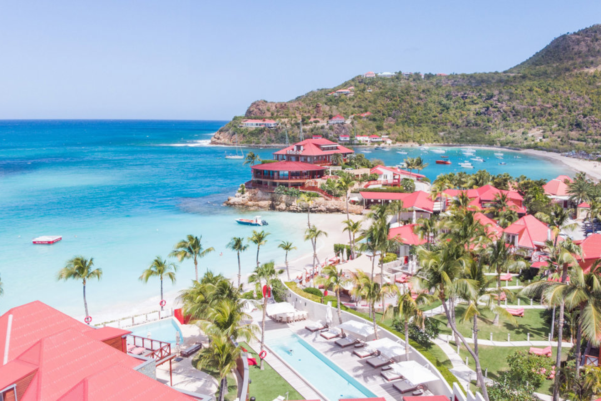 Aerial view of Eden Rock St. Barths, showing the resort’s location on St. Jean Bay with turquoise waters and red-roofed villas.