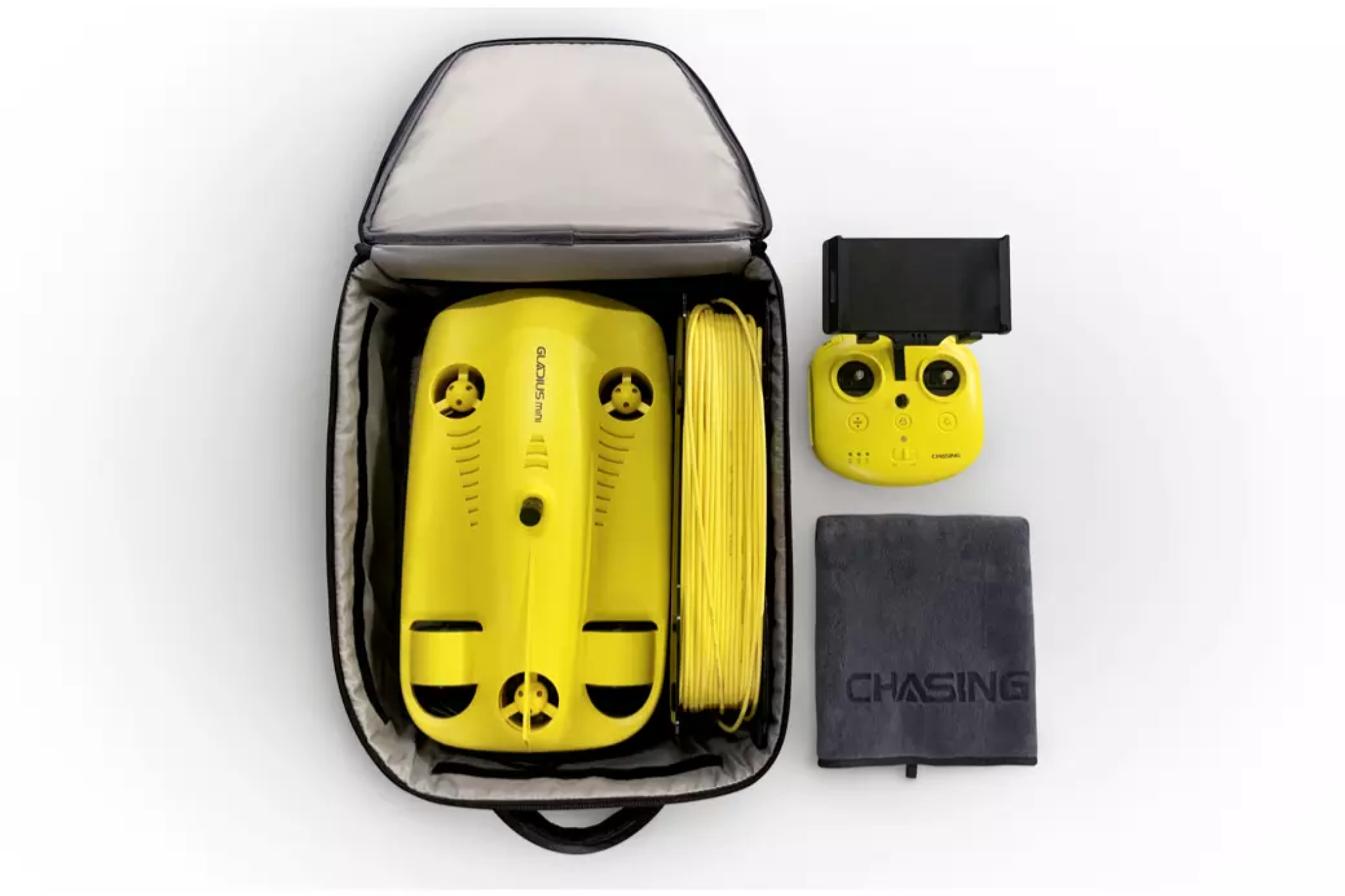 Complete Gladius Mini kit displayed in a carry case, including the underwater drone, tether cable, controller, and accessories for portable exploration and quick deployment.