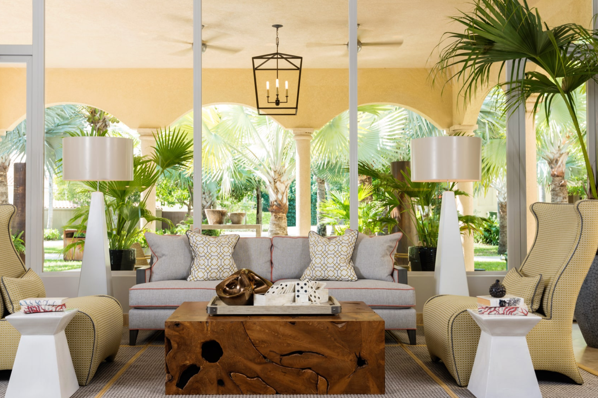 Grace Bay Club lobby lounge featuring tropical decor, designer furnishings, and garden views.